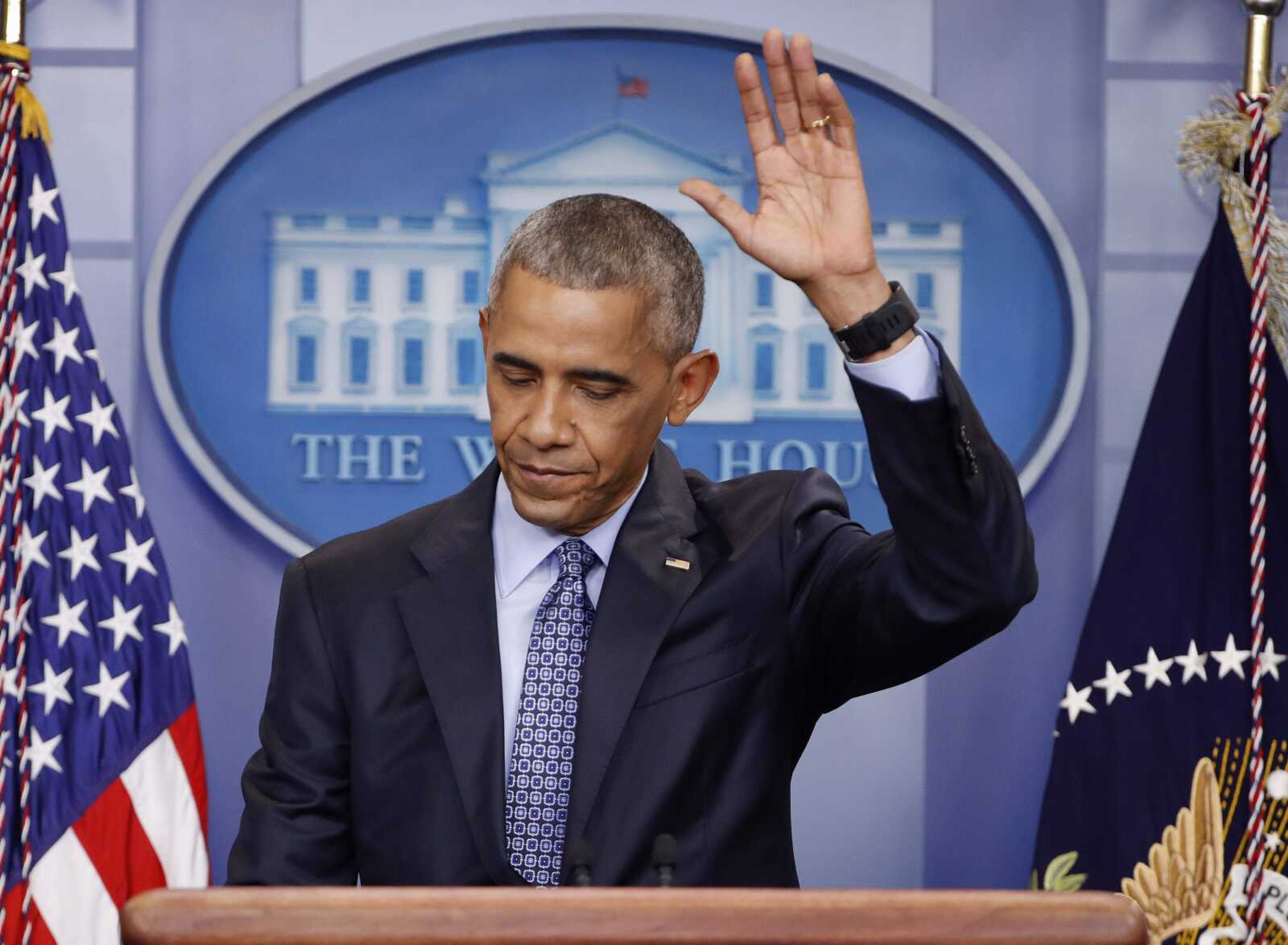 President Barack Obama waves at the conclusion of his final presidential news conference Wednesday in the briefing room of the white House in Washington.