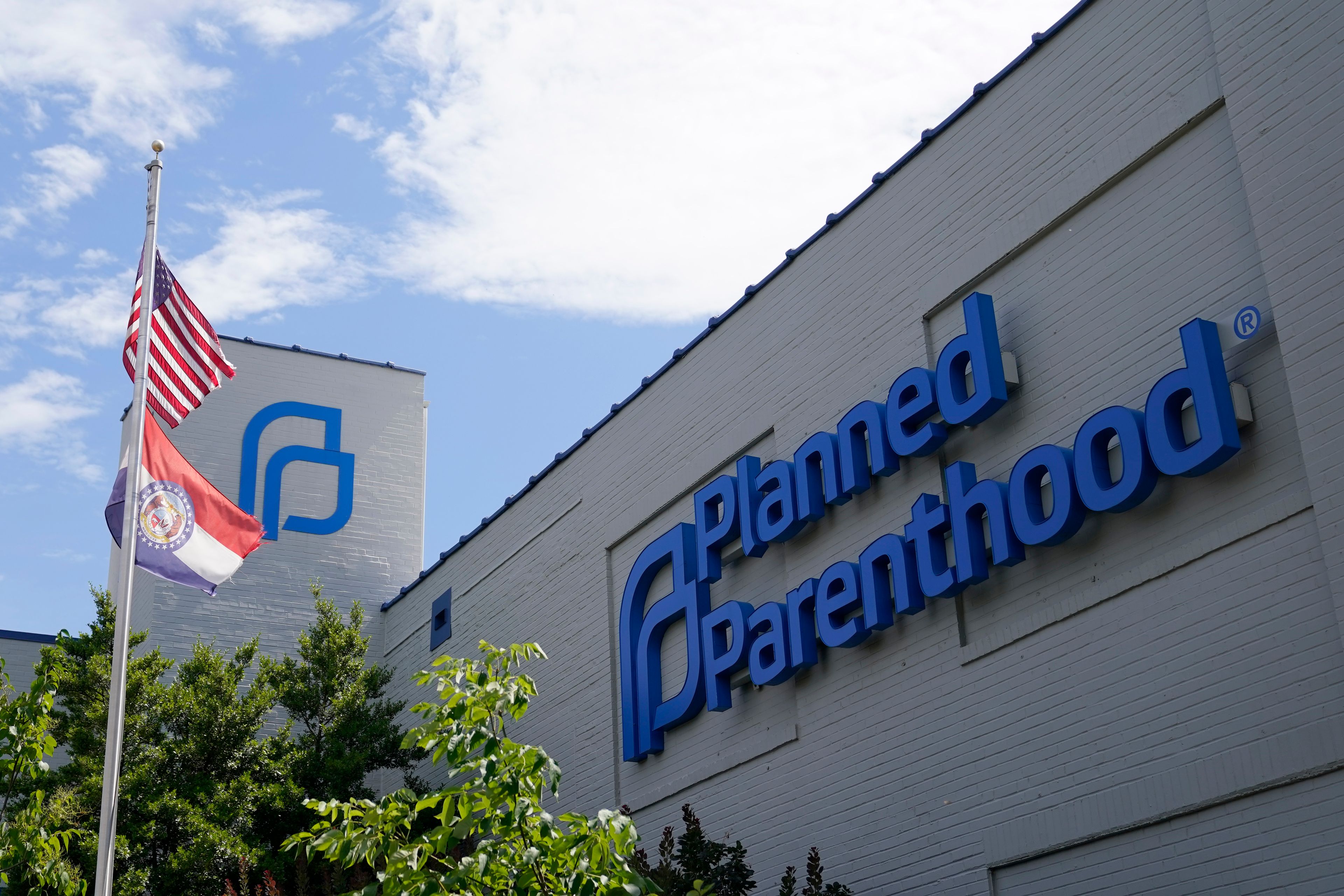 FILE - A Missouri and American flag fly outside Planned Parenthood in St. Louis, June 24, 2022. (AP Photo/Jeff Roberson, File)