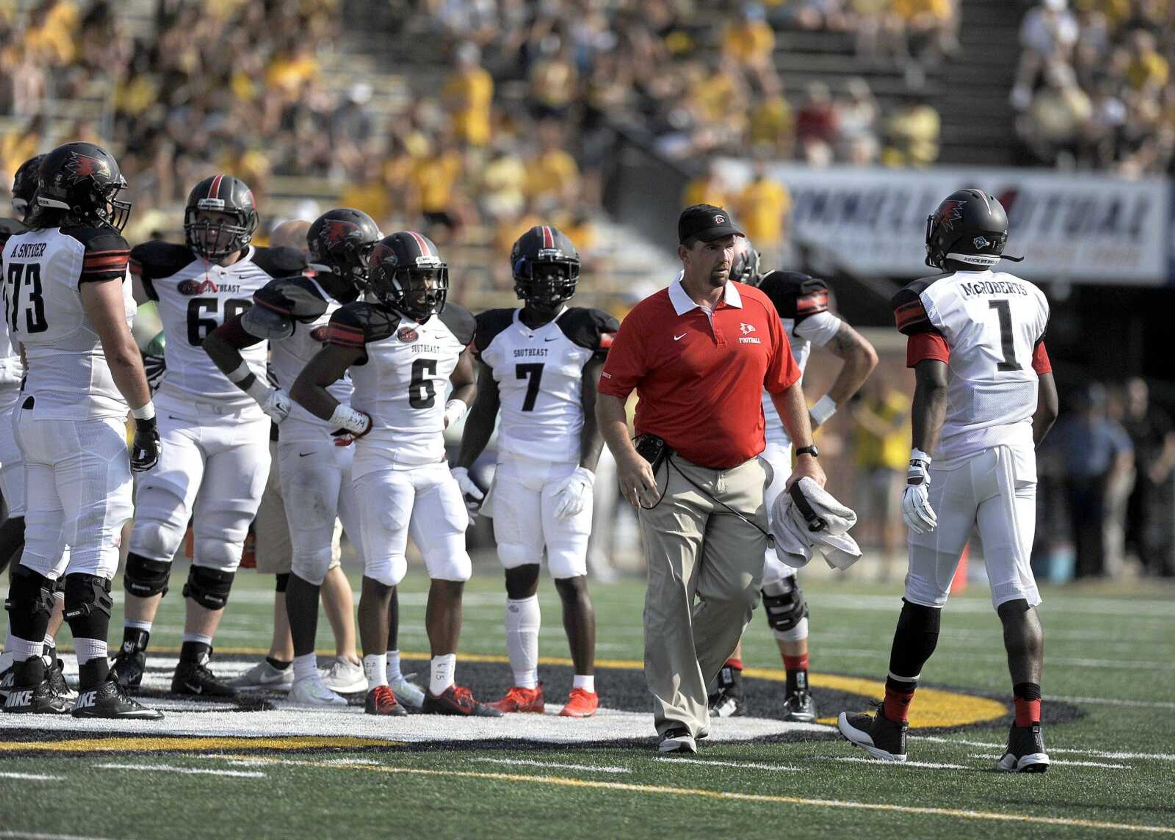 Southeast Missouri State head coach Tom Matukewicz speaks with his players on the field in the third quarter against Mizzou, Saturday, Sept. 5, 2015, at Faurot Field in Columbia, Missouri. Mizzou defeated Southeast 34-3. (Laura Simon)