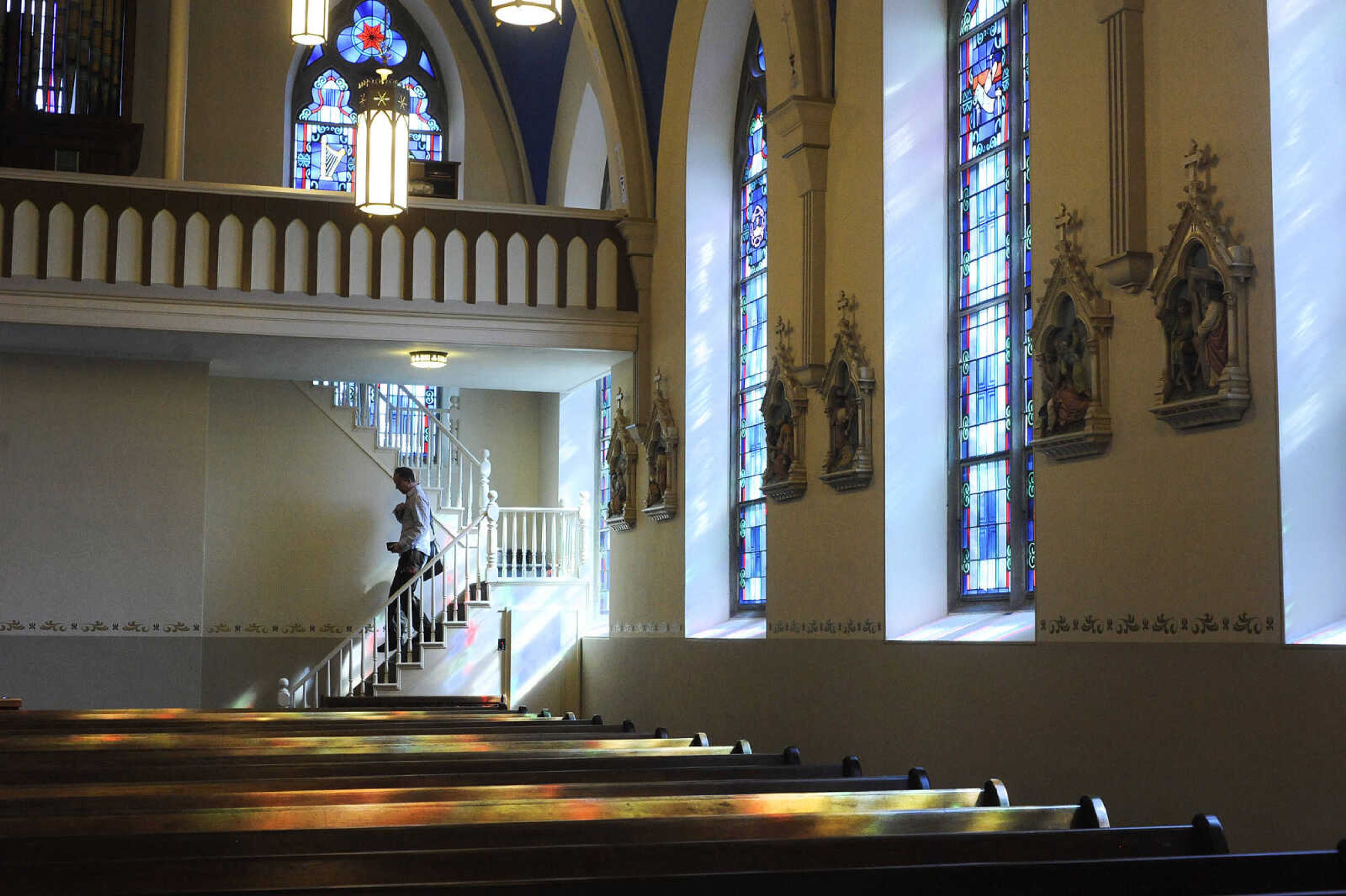 LAURA SIMON ~ lsimon@semissourian.com

Daniel Seiler walks down the choir loft stairs after the first mass inside the newly remodeled St. John's Catholic Church in Leopold, Missouri on Sunday, May 29, 2016.