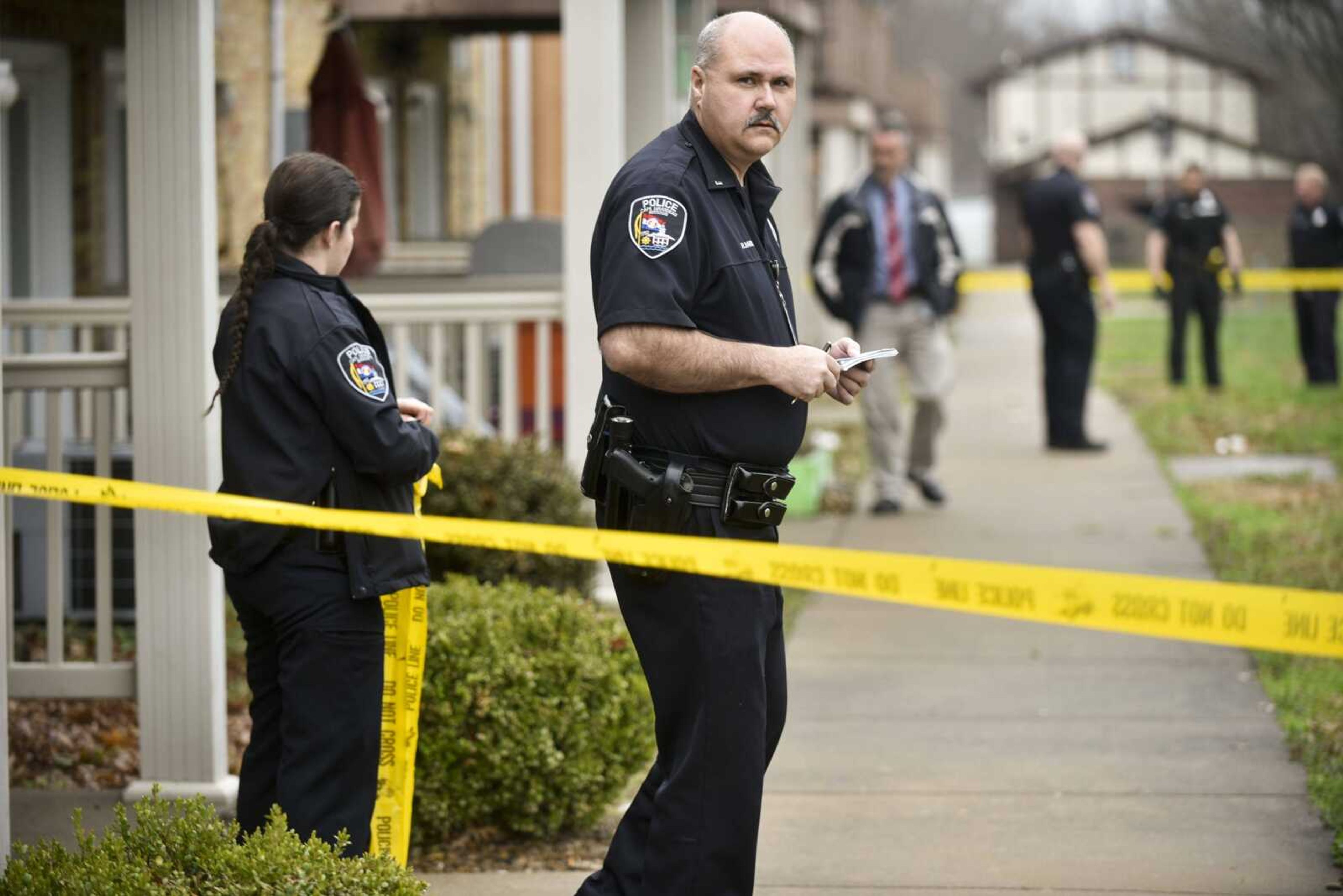 Law enforcement personnel investigate the scene of a shooting in the 500 block of Cape Meadows Circle that left two people dead Wednesday in Cape Girardeau.