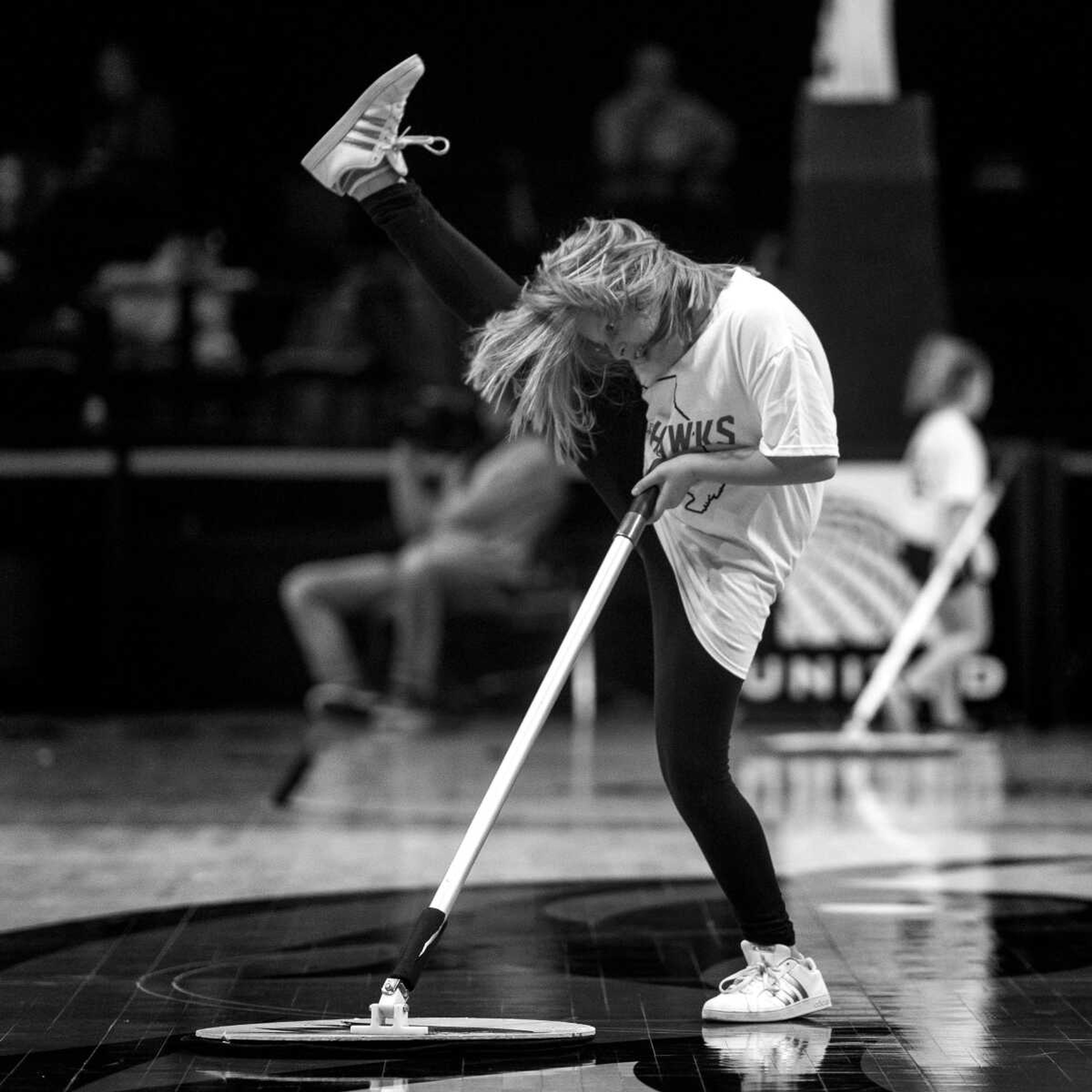 Lily Harper high-kicks along to the pep band's rendition of Taylor Swift's "Shake It Off" while ostensibly mopping sweat off the gym floor during a timeout in the 4th quarter of a game between the Southeast Missouri State University Redhawks and the Austin Peay Governors at the Show Me Center Thursday, Jan. 10, 2019.