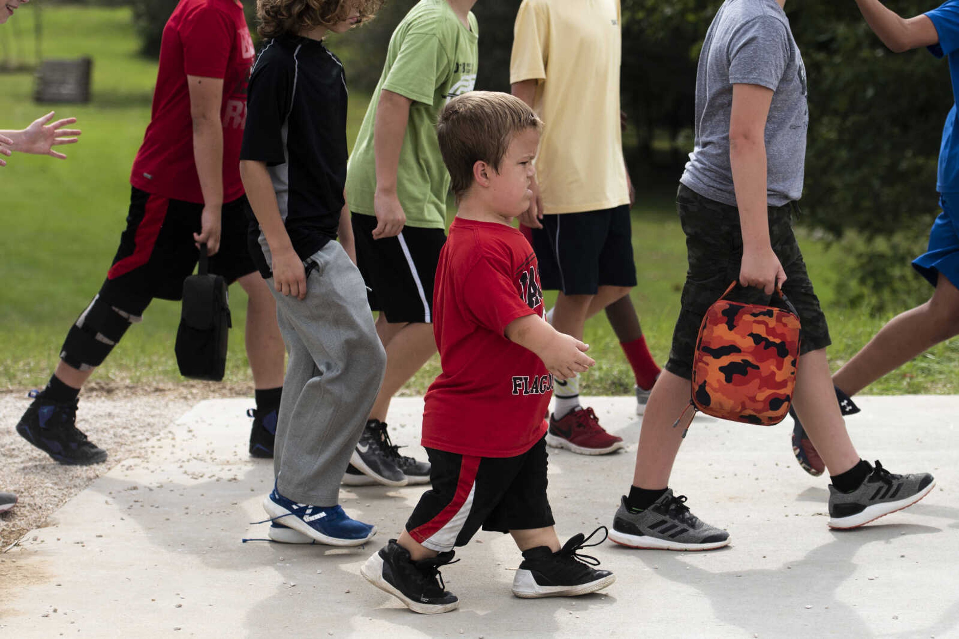 Izaac Pursley walks amongst his Jackson Middle School peers and classmates after recess Oct. 4, 2018, in Jackson.