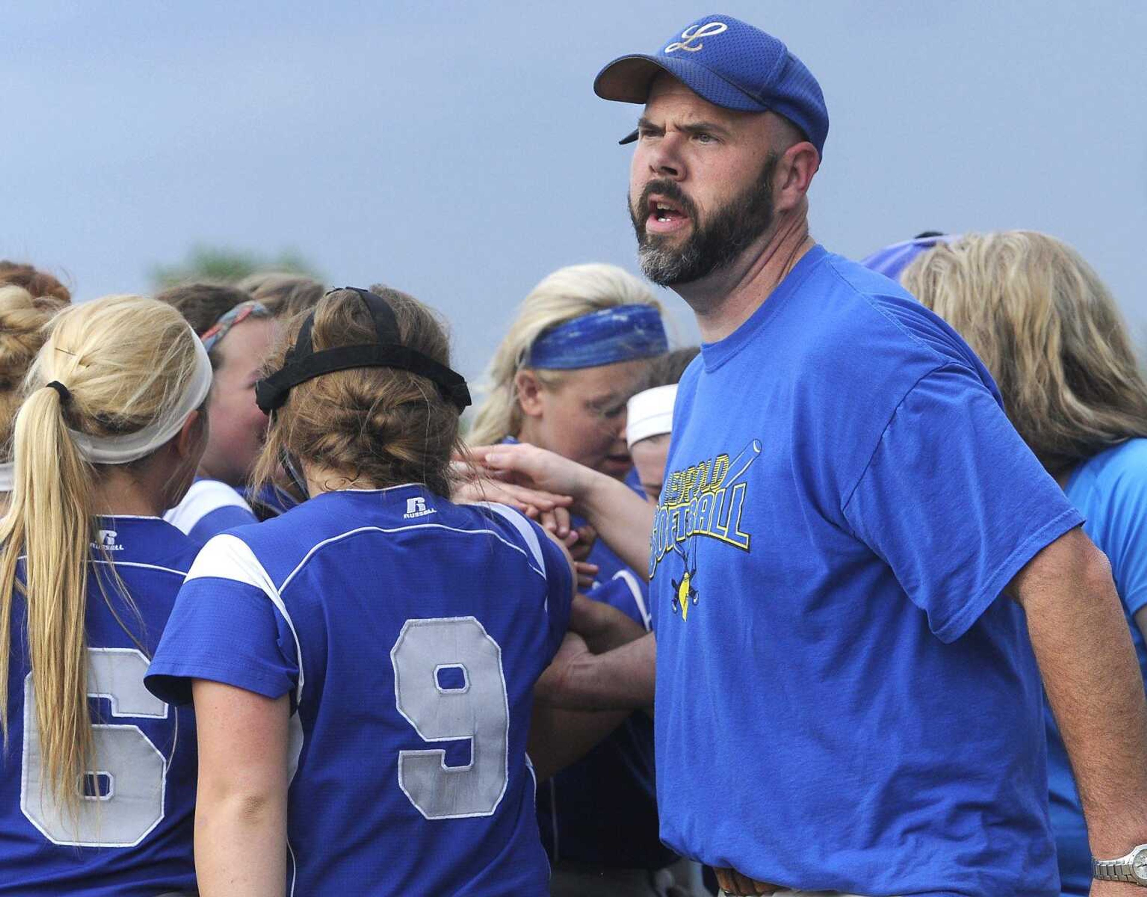 Leopold coach Keenan Kinder leads a cheer with his team before they bat against Advance in a semifinal game of the Class 1 District 4 softball tournament Tuesday, May 5, 2015 in Scott City. (Fred Lynch)