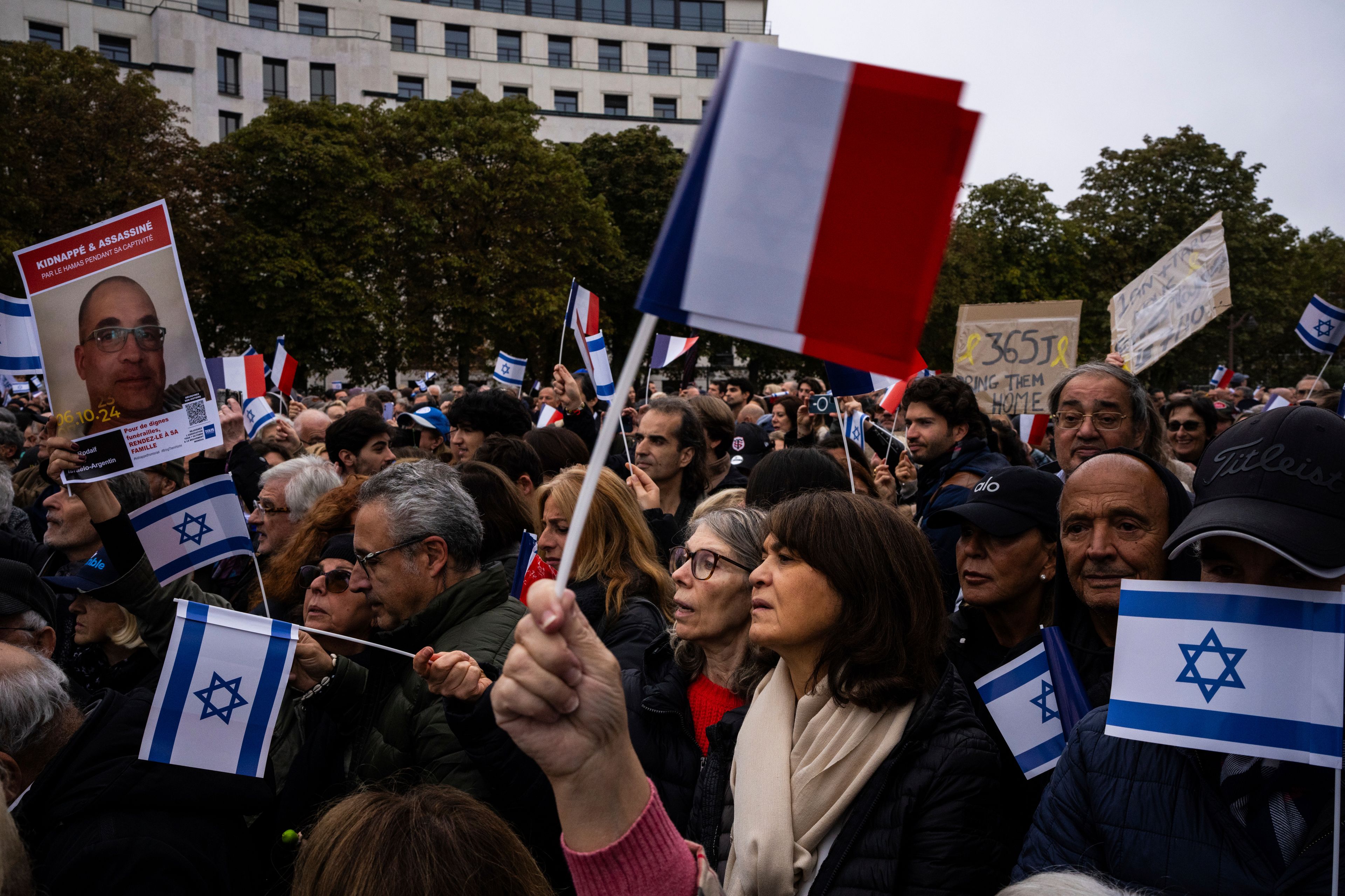 People attend a demonstration in support of Israel to mark the first anniversary of the Hamas attack on Israel, in Paris, Sunday, Oct. 6, 2024.(AP Photo/Louise Delmotte)