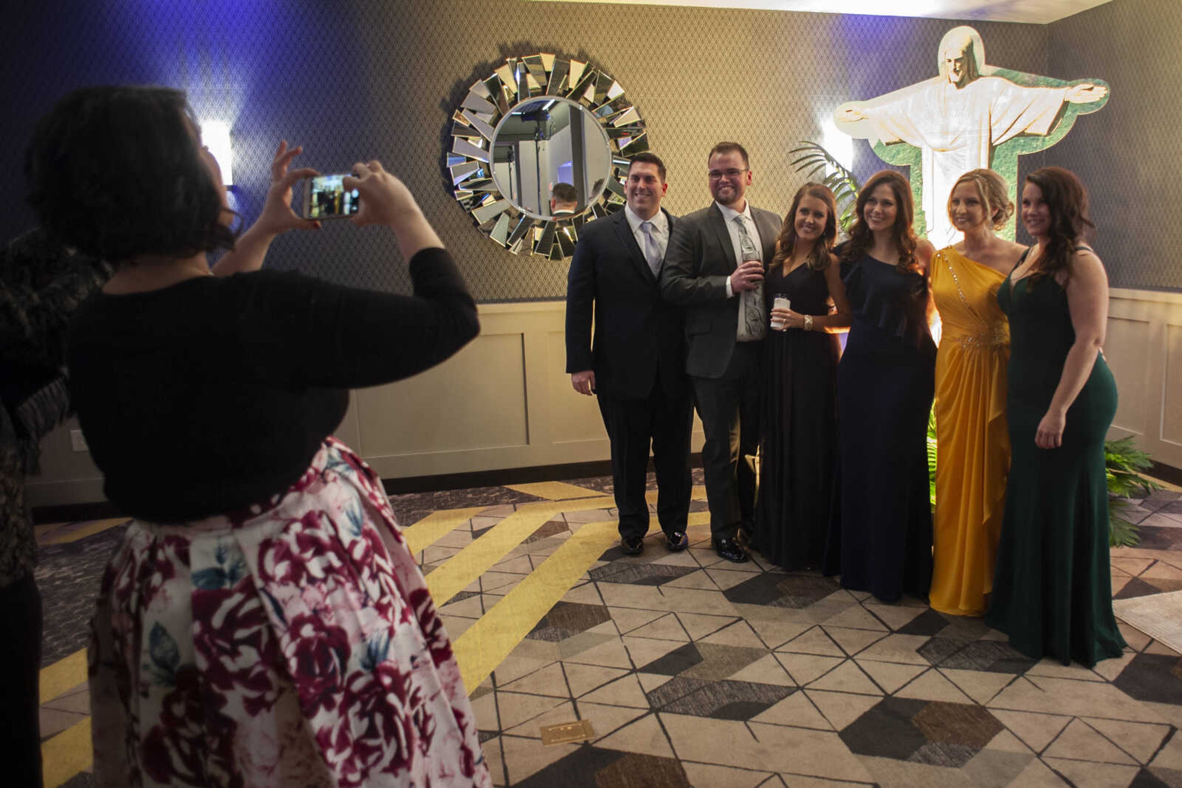 Jill Sanders of Cape Girardeau takes a photo of a group of gala attendees during the 2019 Journey Gala at the Drury Plaza Hotel Conference Center on Saturday, Jan. 19, 2019, in Cape Girardeau. The gala benefits cancer patients at Southeast Cancer Center.