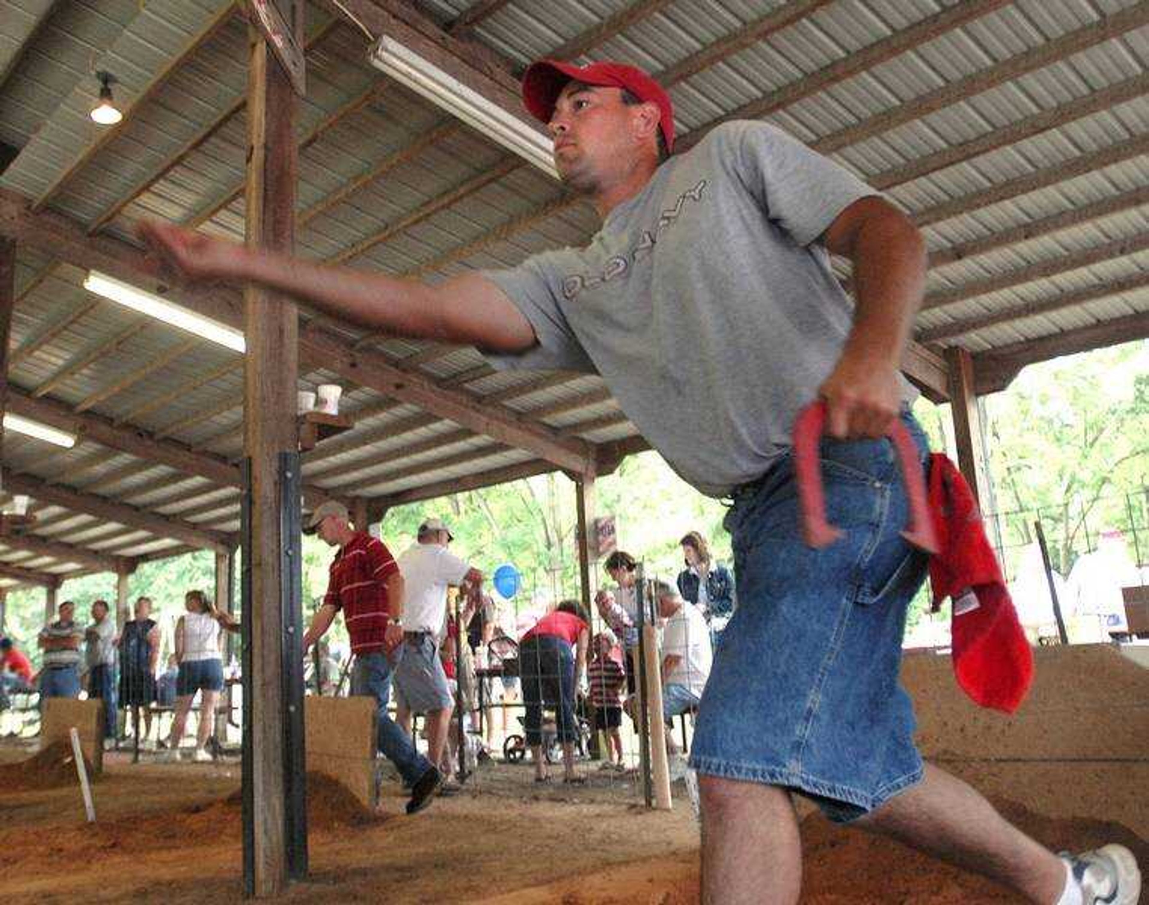 FRED LYNCH ~ flynch@semissourian.com
Blake Burger of New Hamburg, Mo., pitched horseshoes Friday at the Knights of Columbus Fourth of July Picnic in Oran, Mo.