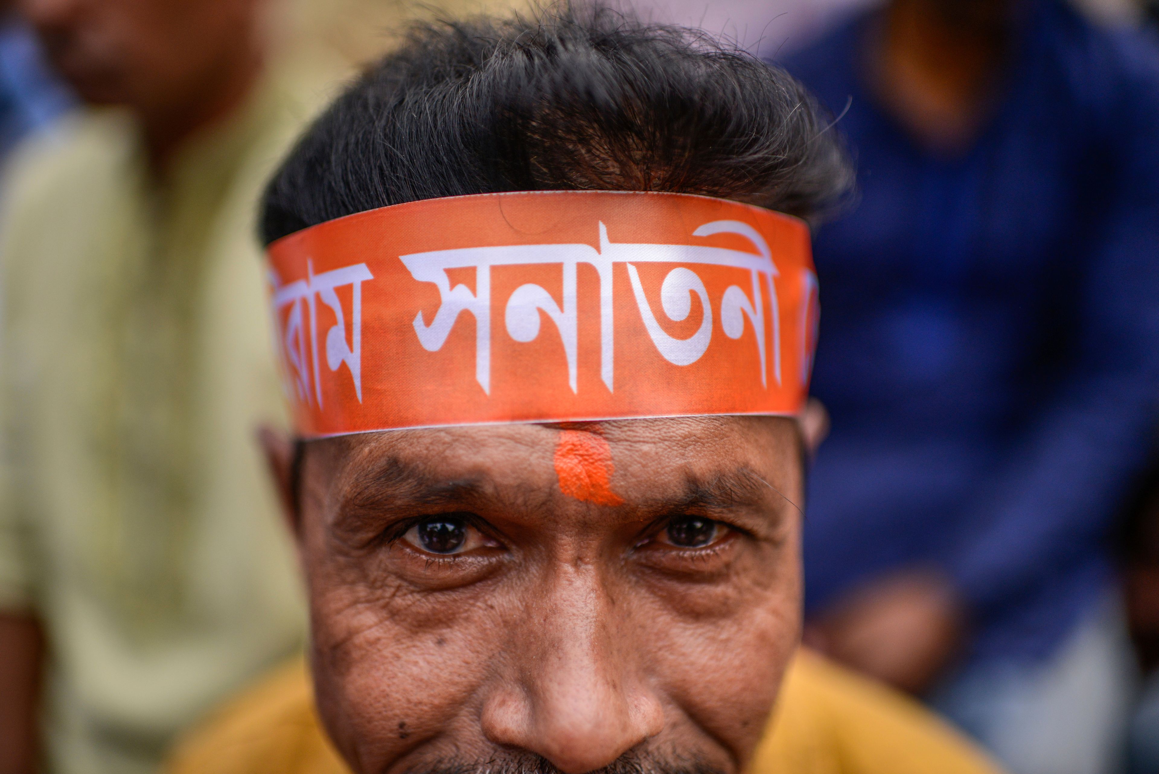 A Bangladesh Hindu participates in a protest rally to demand that an interim government withdraw all cases against their leaders and protect them from attacks and harassment in Dhaka, Bangladesh, Saturday, Nov. 2, 2024. (AP Photo/Mahmud Hossain Opu)