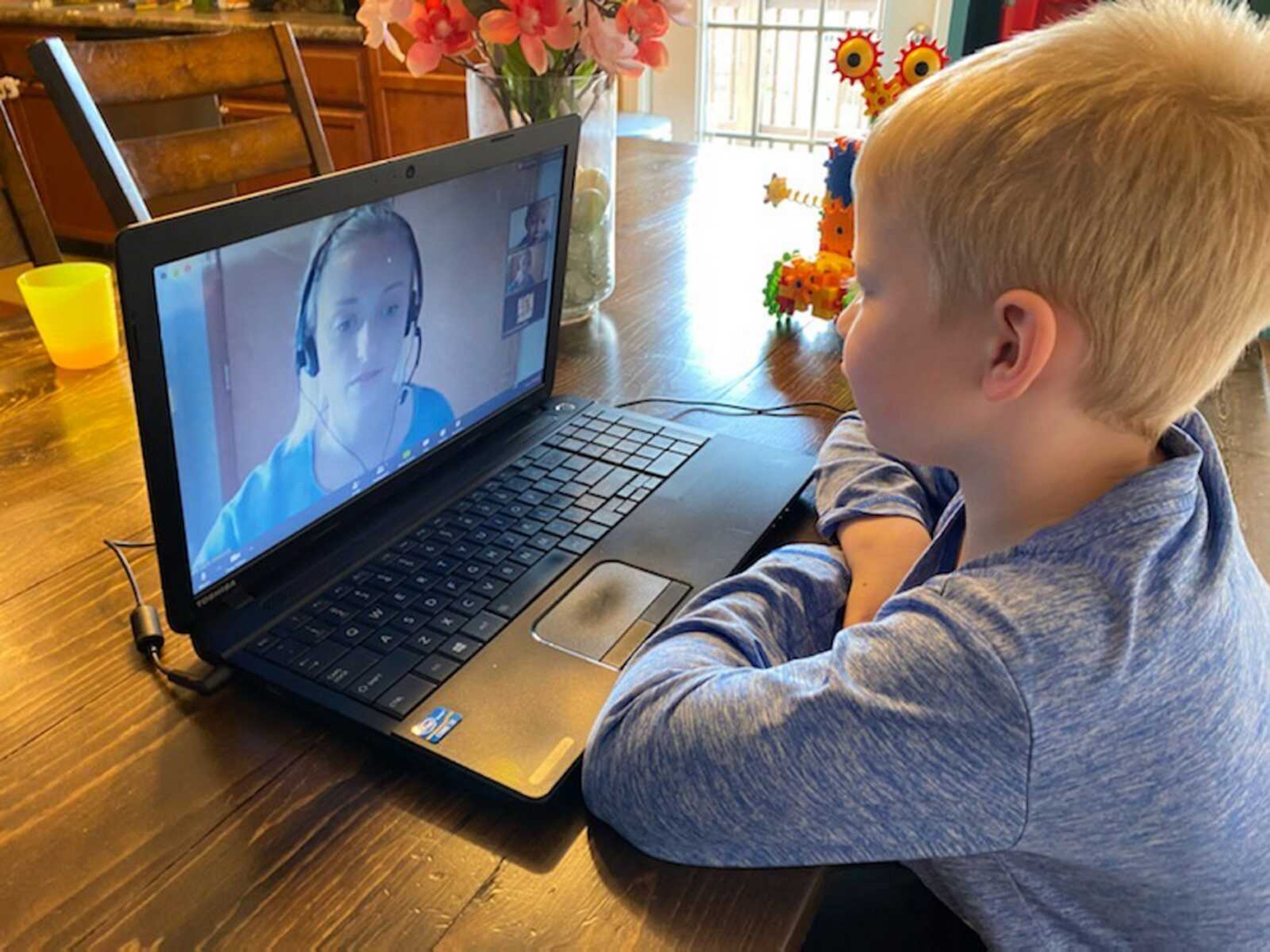 Grayson Gantz works at a laptop during a teletherapy session with student clinician Ashton Glascock from Southeast Missouri State University's Center for Speech and Hearing on April 2 at his Gordonville home.