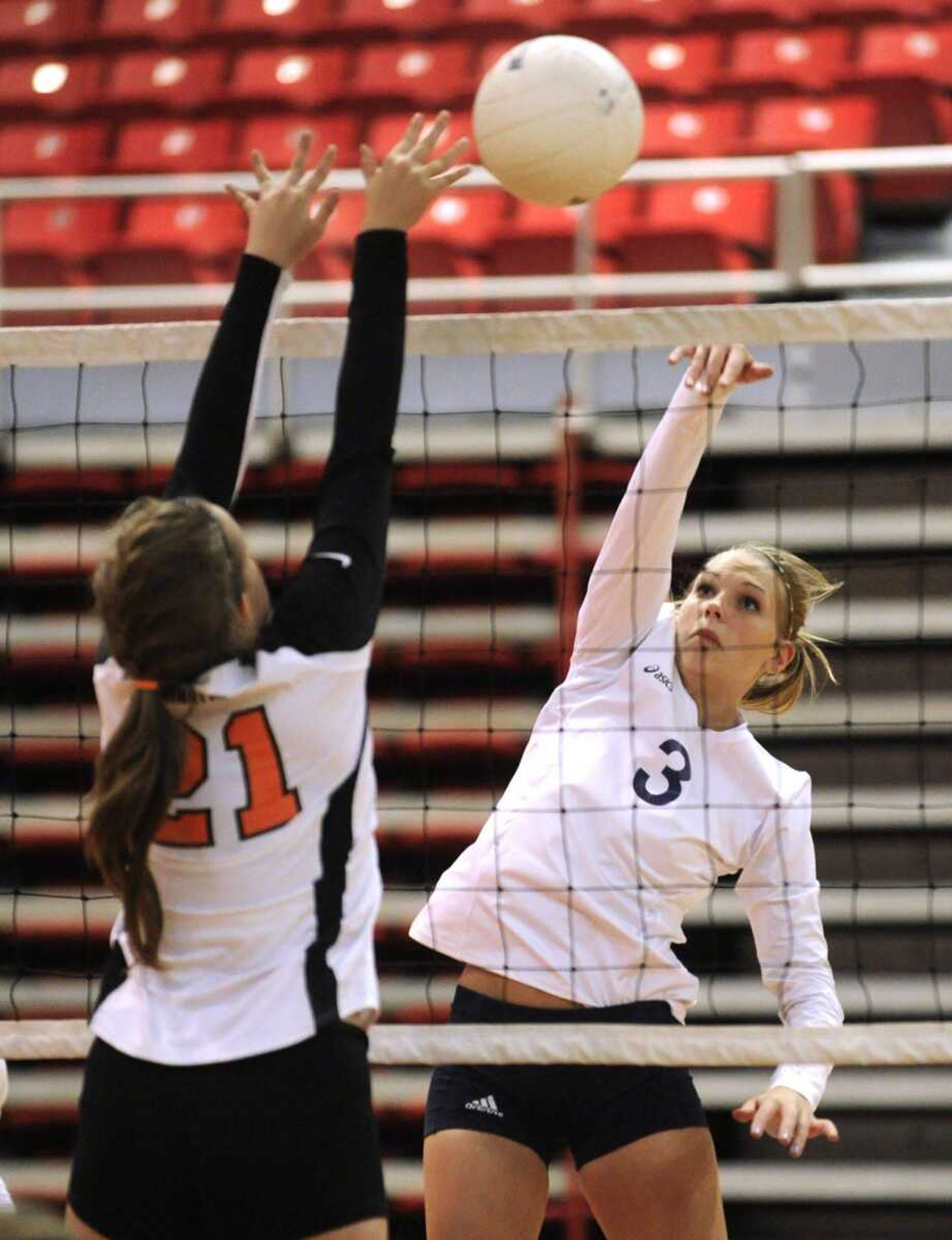 Saxony Lutheran&#8217;s Jordan Hoff spikes over Clearwater&#8217;s McKenzie Brinkley in the silver bracket championship match of the SEMO Spike Volleyball Classic on Saturday at the Show Me Center. (Fred Lynch)