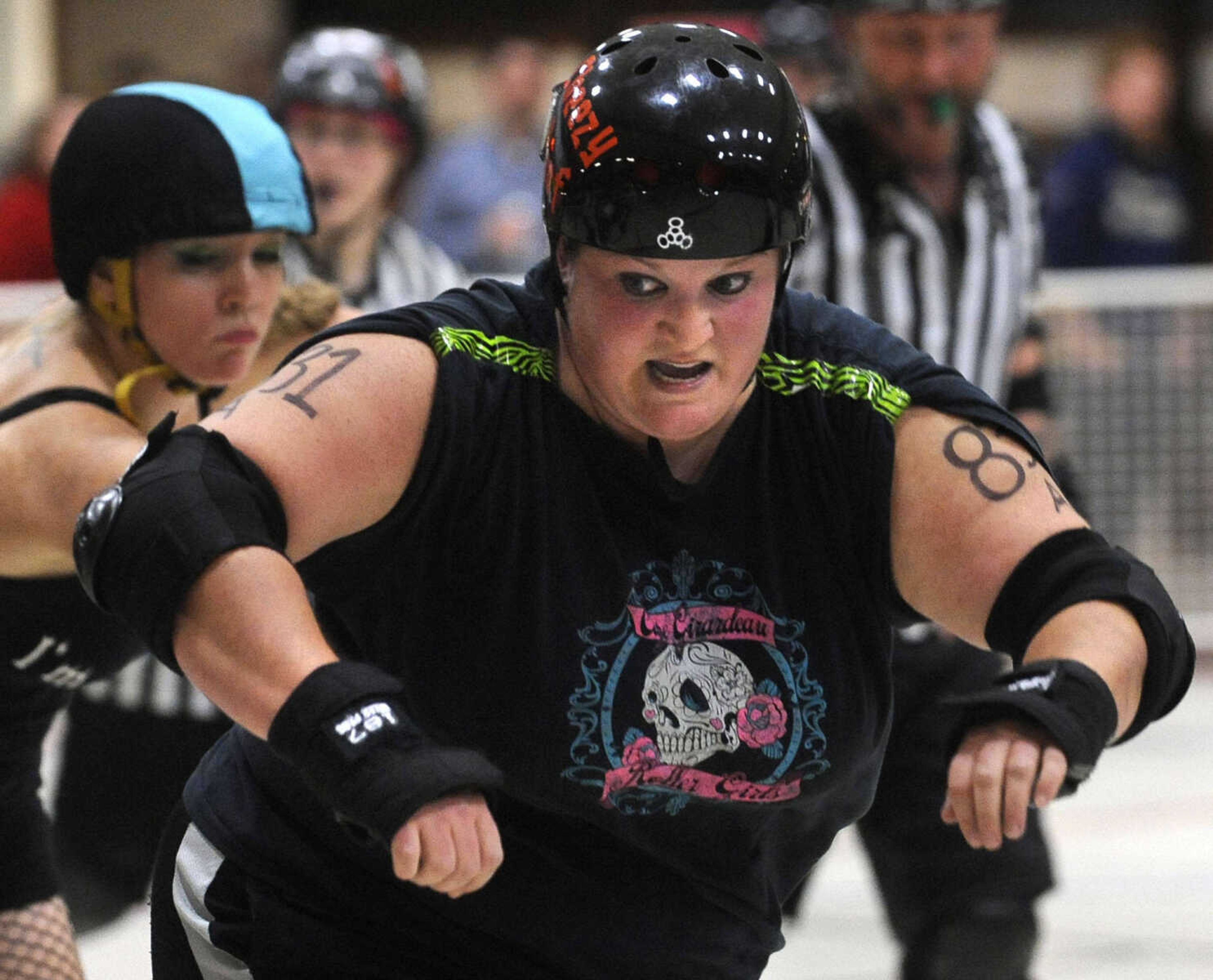 FRED LYNCH ~ flynch@semissourian.com
Cheezy Poof tries to block a jammer during Capetown Smackdown IV. The Cape Girardeau Roller Girls skated their final bout of the season, on Friday, Nov. 8, 2013 at the Arena Building.