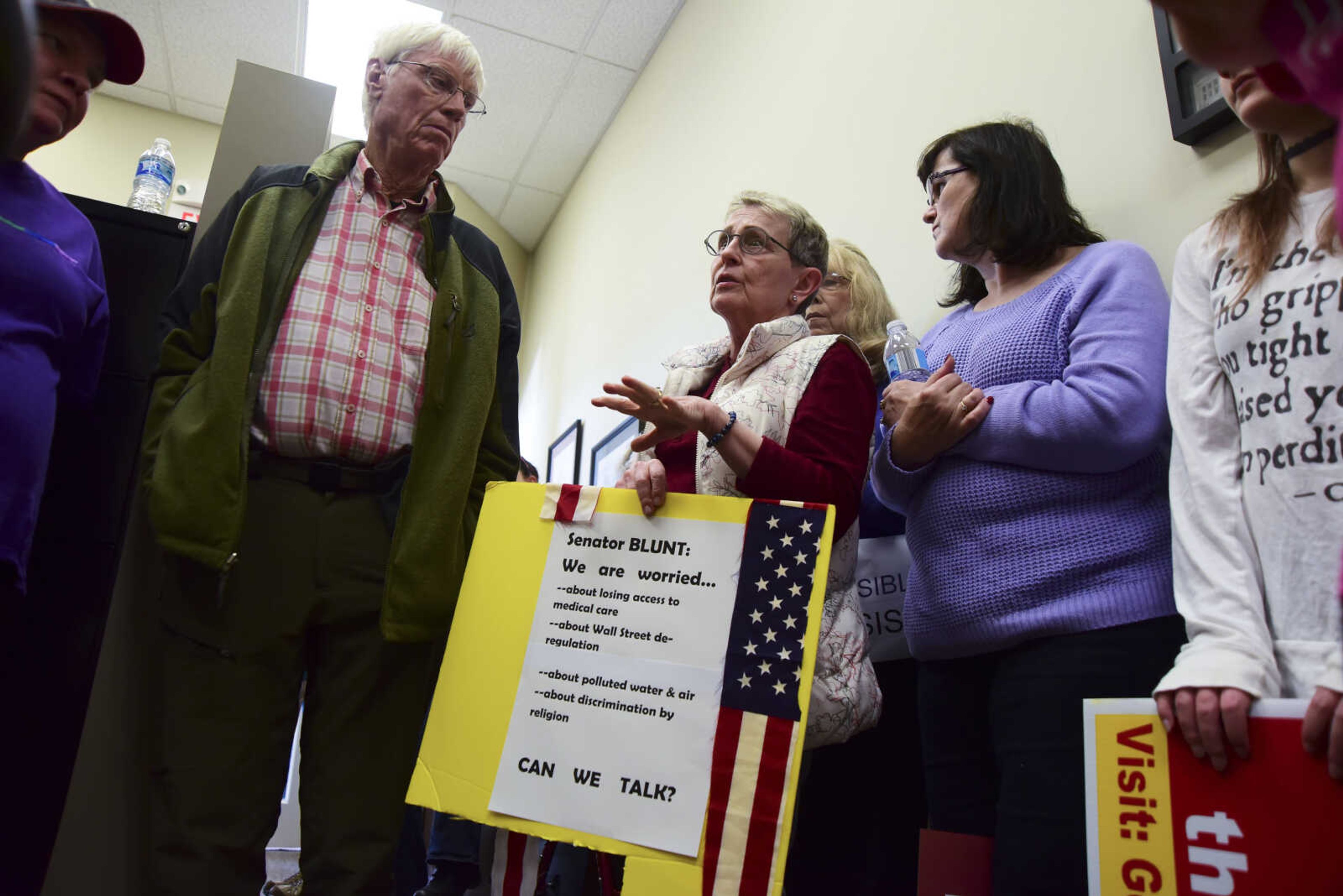 People bring up concerns they have with District Director, Darren Lingle, for Senator Roy Blunt in U.S. Sen. Roy Blunt's office Wednesday, Feb. 22, 2017 in Cape Girardeau.