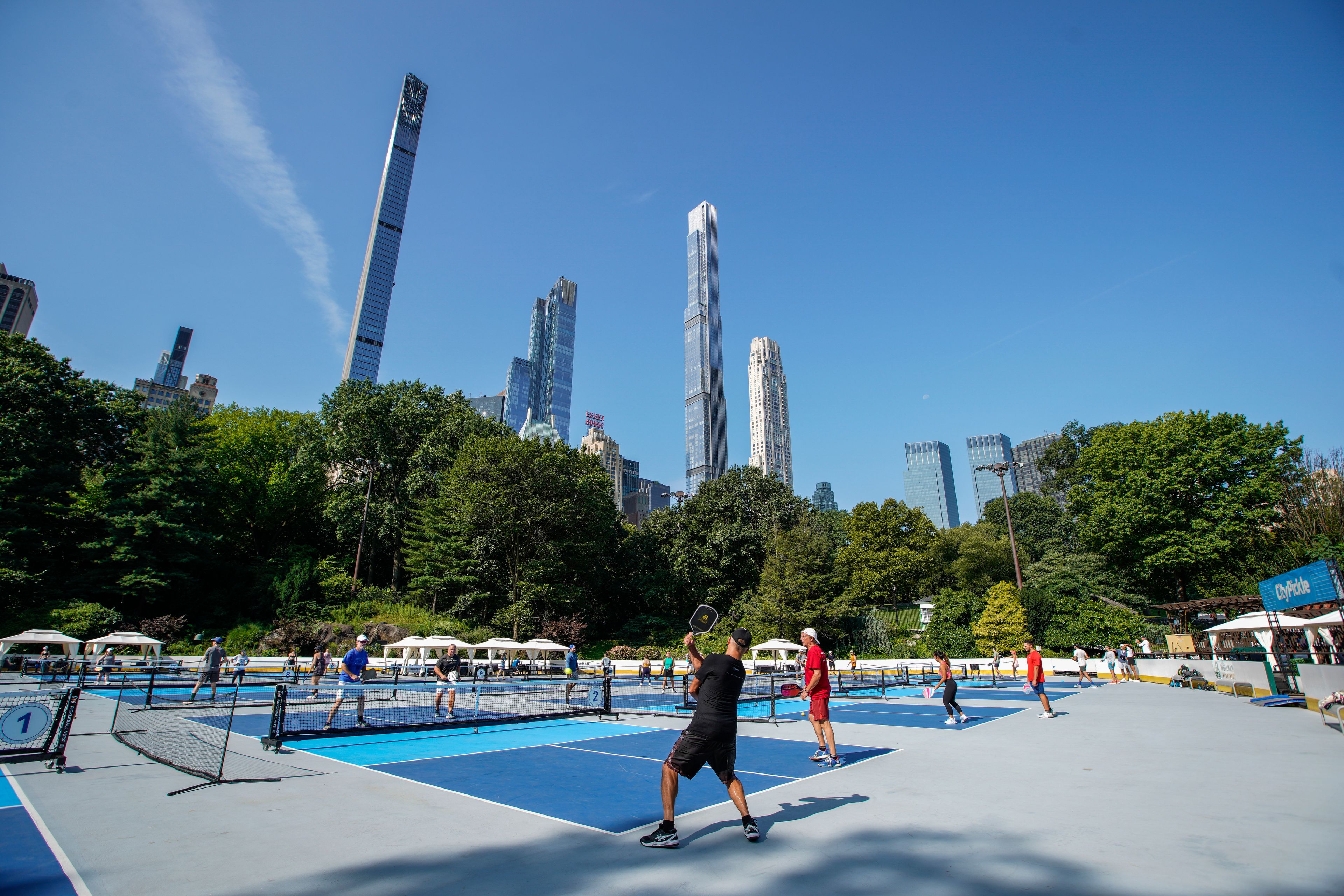 People practice pickleball on the courts of CityPickle at Central Park's Wollman Rink, Saturday, Aug. 24, 2024, in New York. (AP Photo/Eduardo Munoz Alvarez)