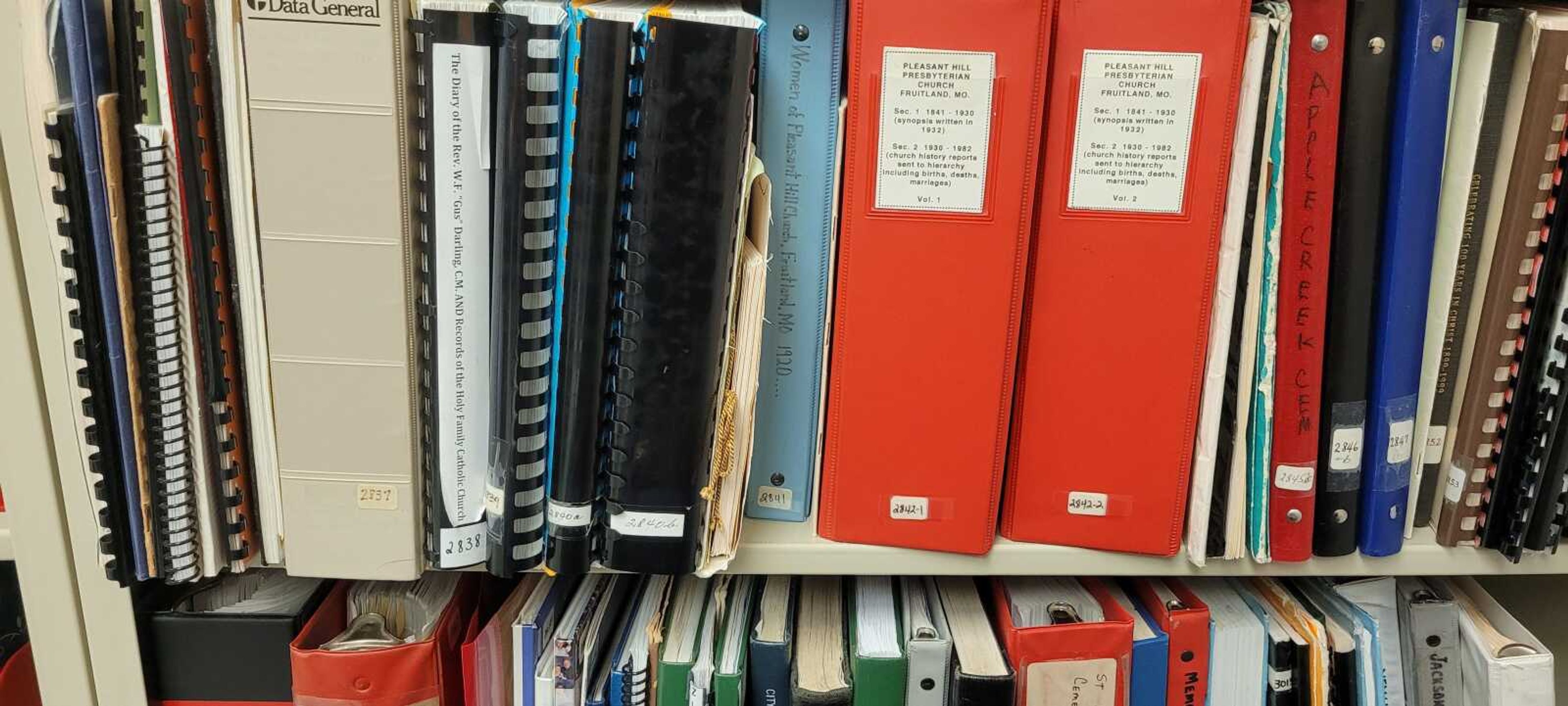 "The Diary of the Reverend W.F. 'Gus' Darling, C.M., and the Records of the Holy Family Catholic Church", by Diana Steele-Bryant and Sharon Sanders, on the shelf with other books in the Cape Girardeau County Genealogical Society collection at the Cape Girardeau County Archive Center in Jackson.