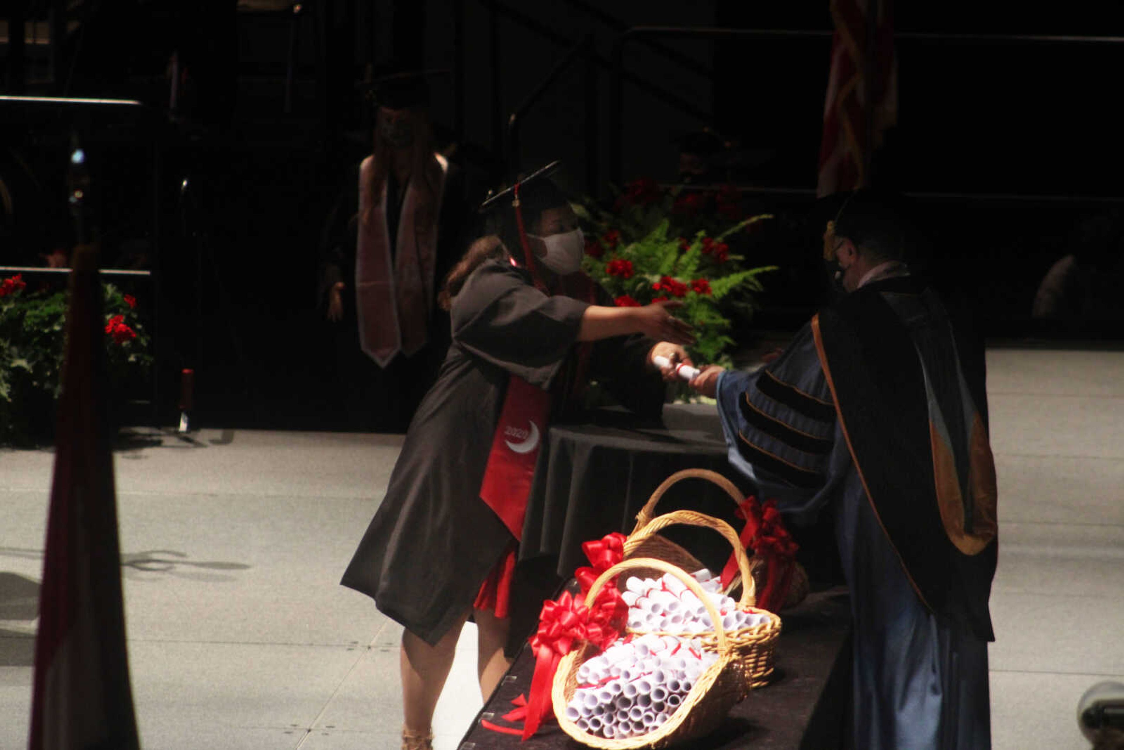 A Southeast graduate receives her diploma from Southeast President Dr. 
Carlos Vargas at the spring commencement ceremony held at 6 p.m. on 
Saturday, May 15, 2021, at the Show Me Center in Cape Girardeau.