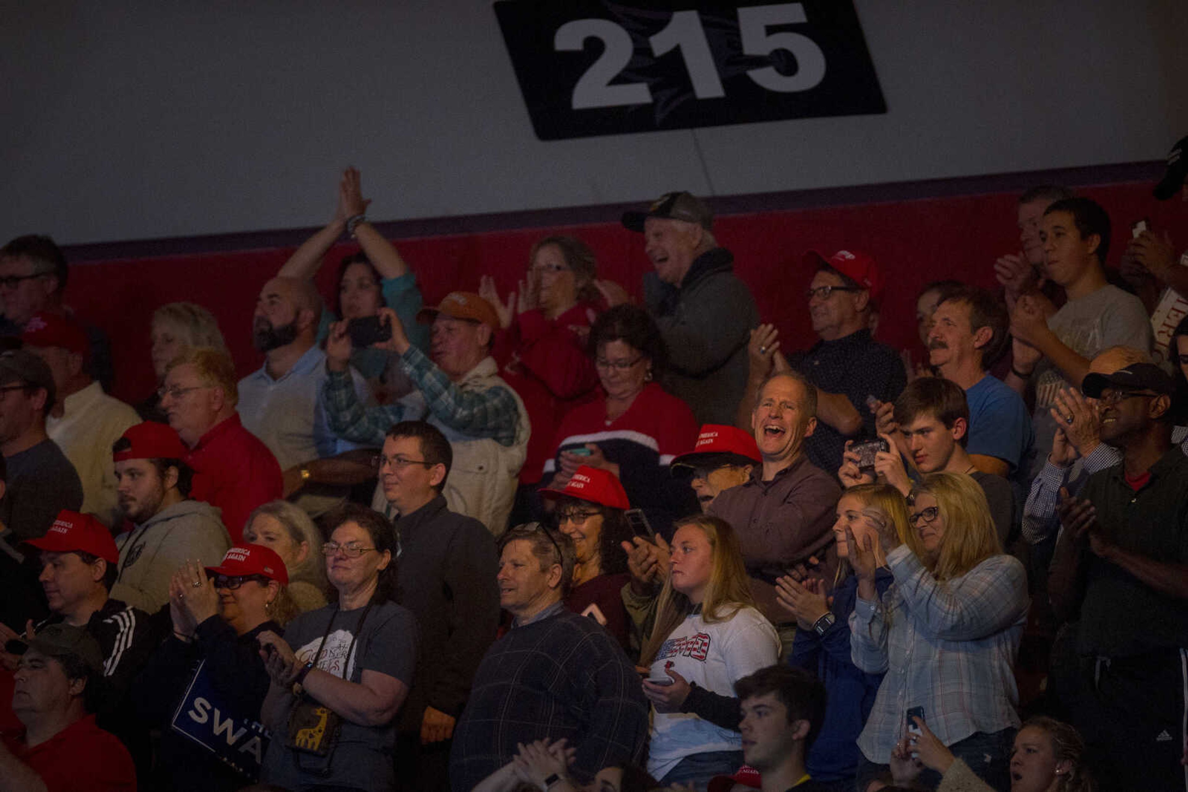 Members of the crowd laugh at the Show Me Center during a rally for President Trump Monday.