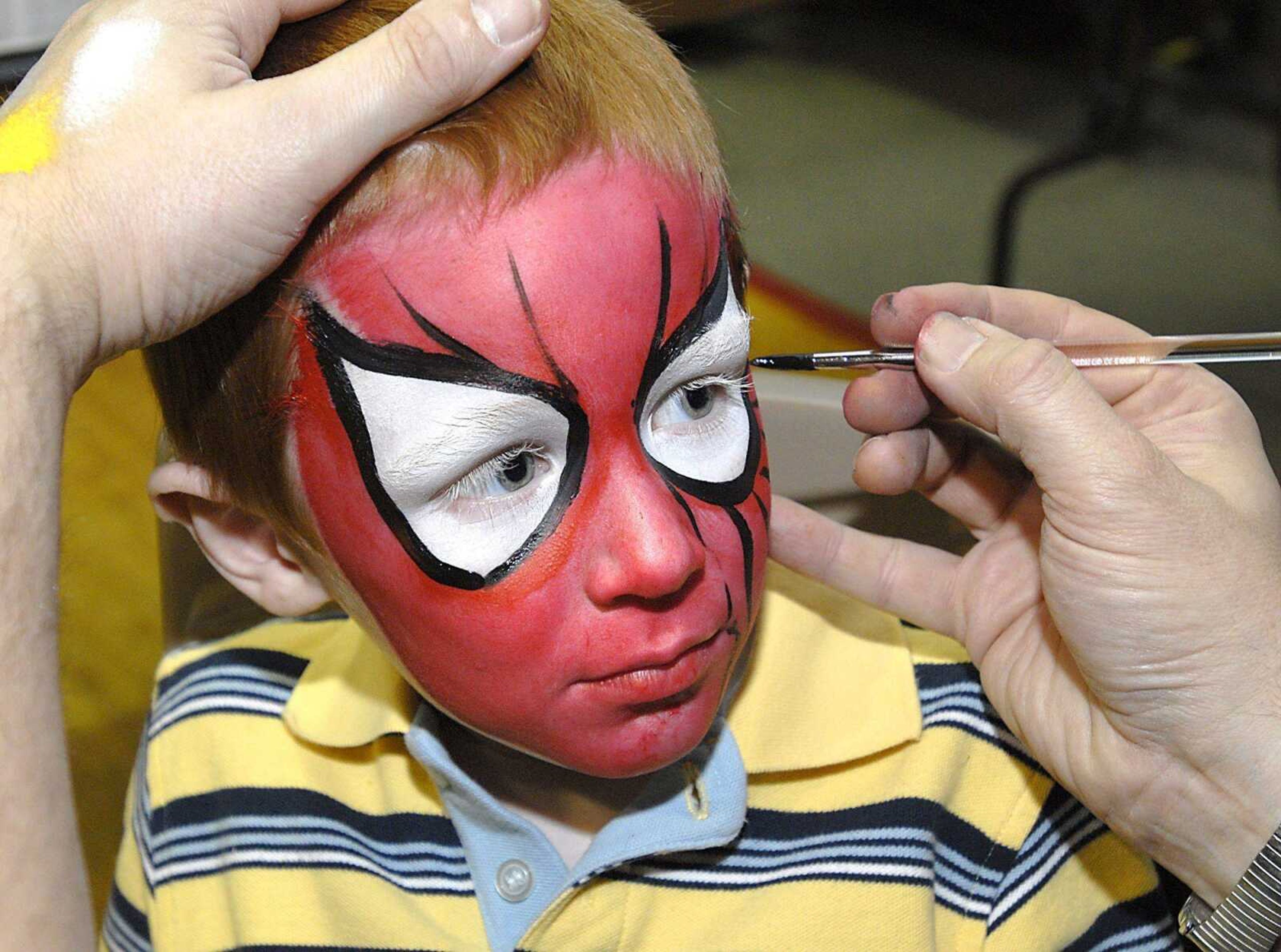 Grant Schaefer of Jackson got a Spiderman face paint by artist Bill Baunach during the 2008 Cape Comic Con. (Southeast Missourian file photo)