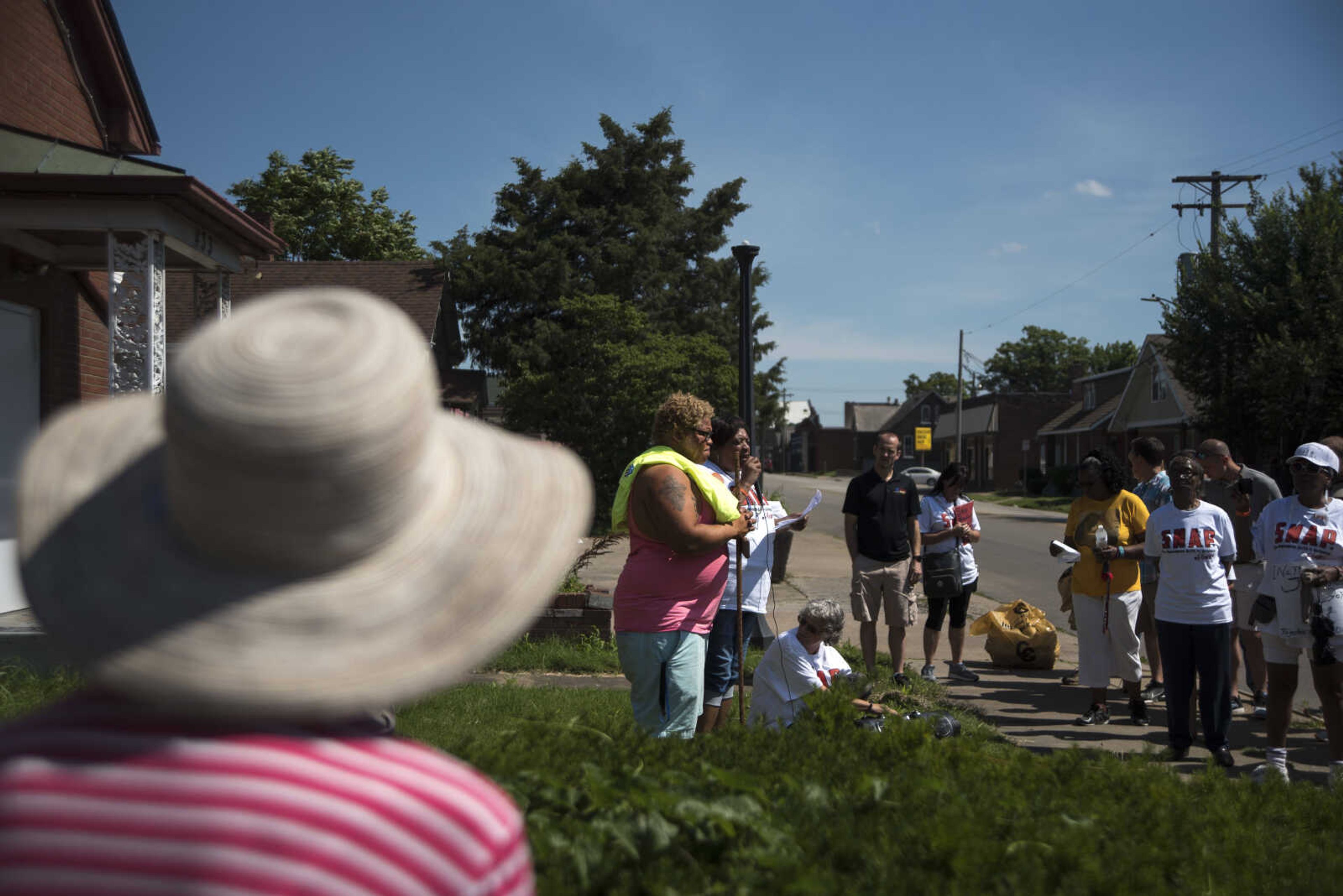 Community Members say a prayer during a Stop Needless Acts of Violence Please (SNAP) prayer march Saturday, June 10, 2017 in Cape Girardeau.