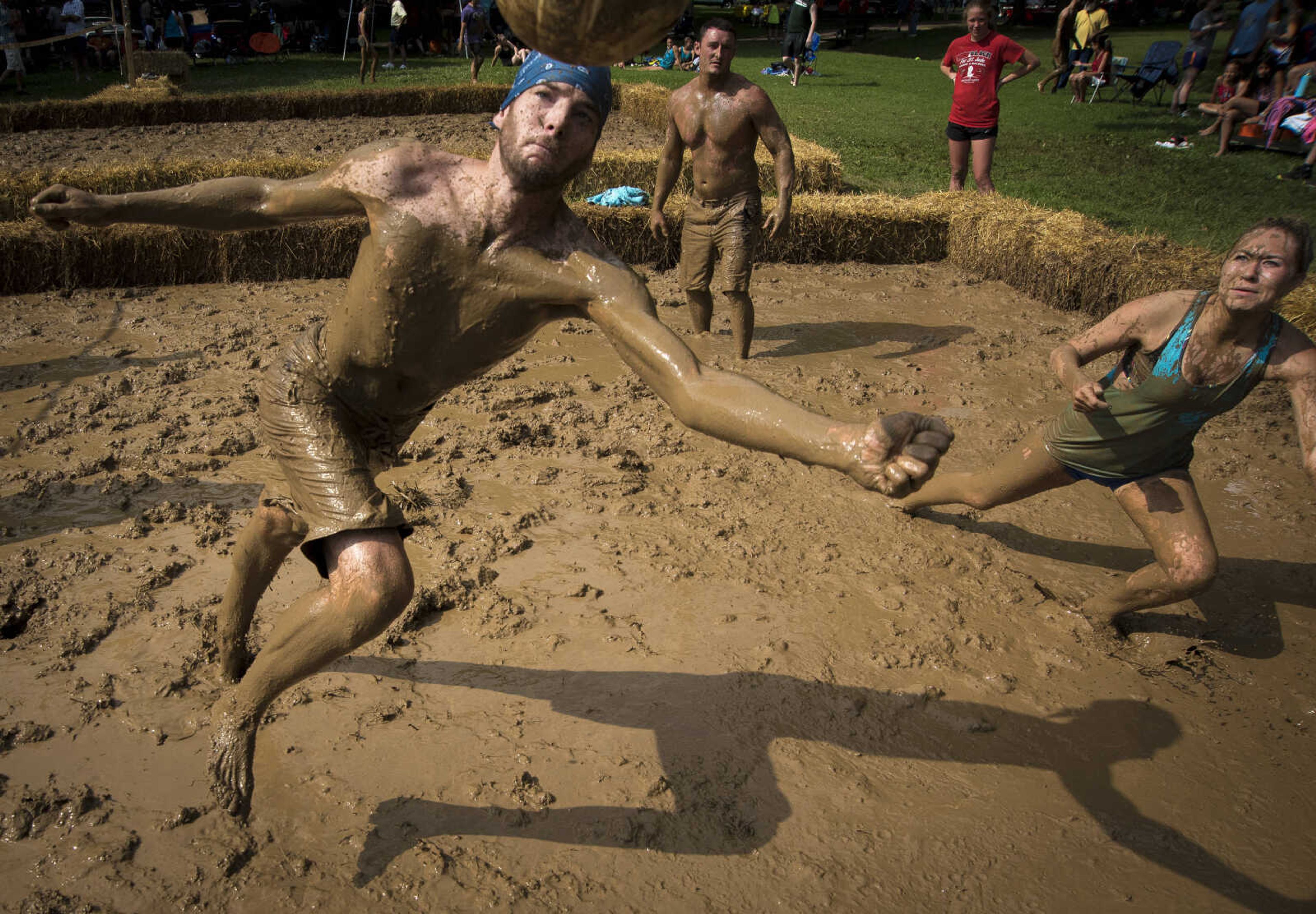 Chris Carr dives for the ball during mud volleyball for the Jackson Parks and Recreation's July 4th celebration Tuesday, July 4, 2017 in Jackson City Park.