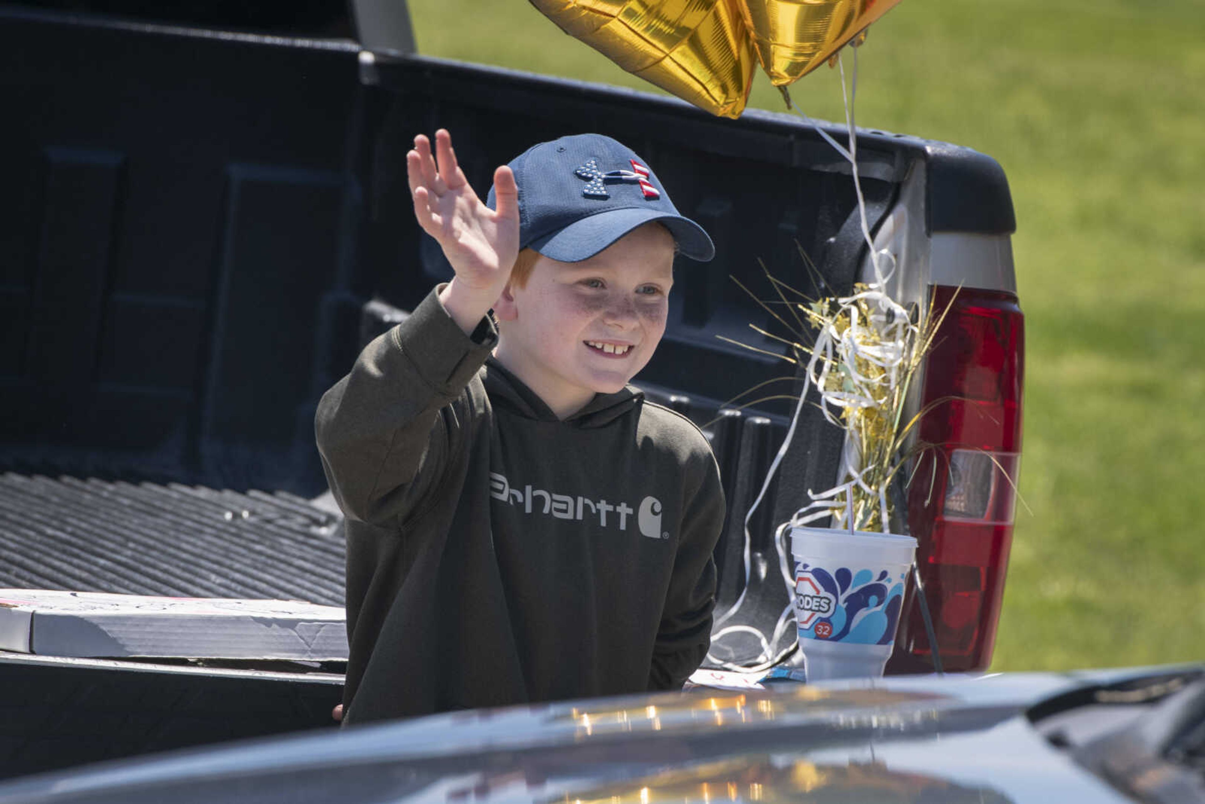 Collin Stephens of Cape Girardeau waves during his surprise-birthday parade Saturday, May 9, 2020, at Shawnee Park in Cape Girardeau. Collin turns 10 on Sunday.