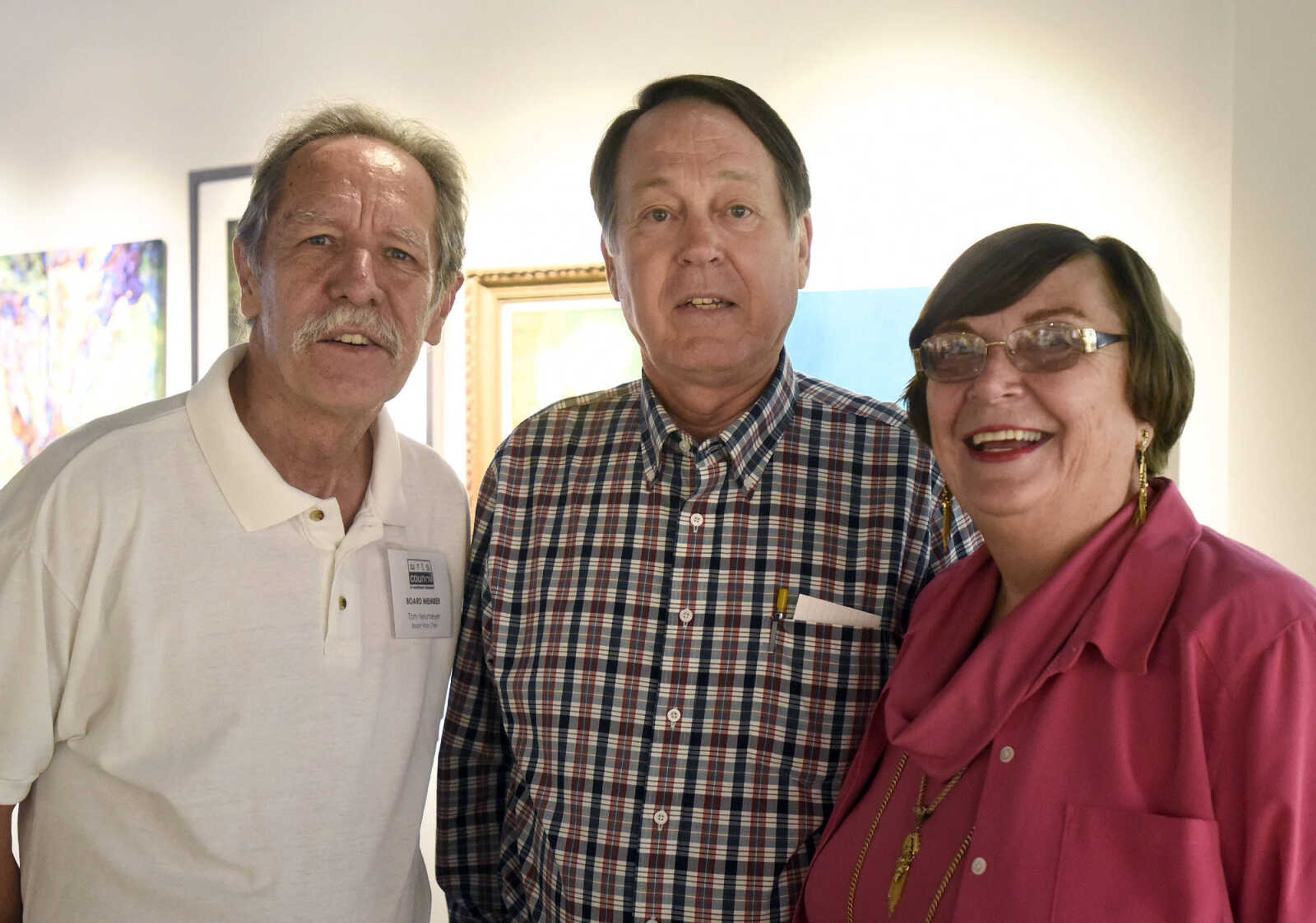 LAURA SIMON ~ lsimon@semissourian.com

Tom Neumeyer, left, and Ann and Bob Gifford pose for a photo during the grand opening reception for the 4th annual Members Exhibit at the Arts Council of Southeast Missouri in its new location at 16 North Spanish Street in downtown Cape Girardeau on Friday, Sept. 2, 2016.