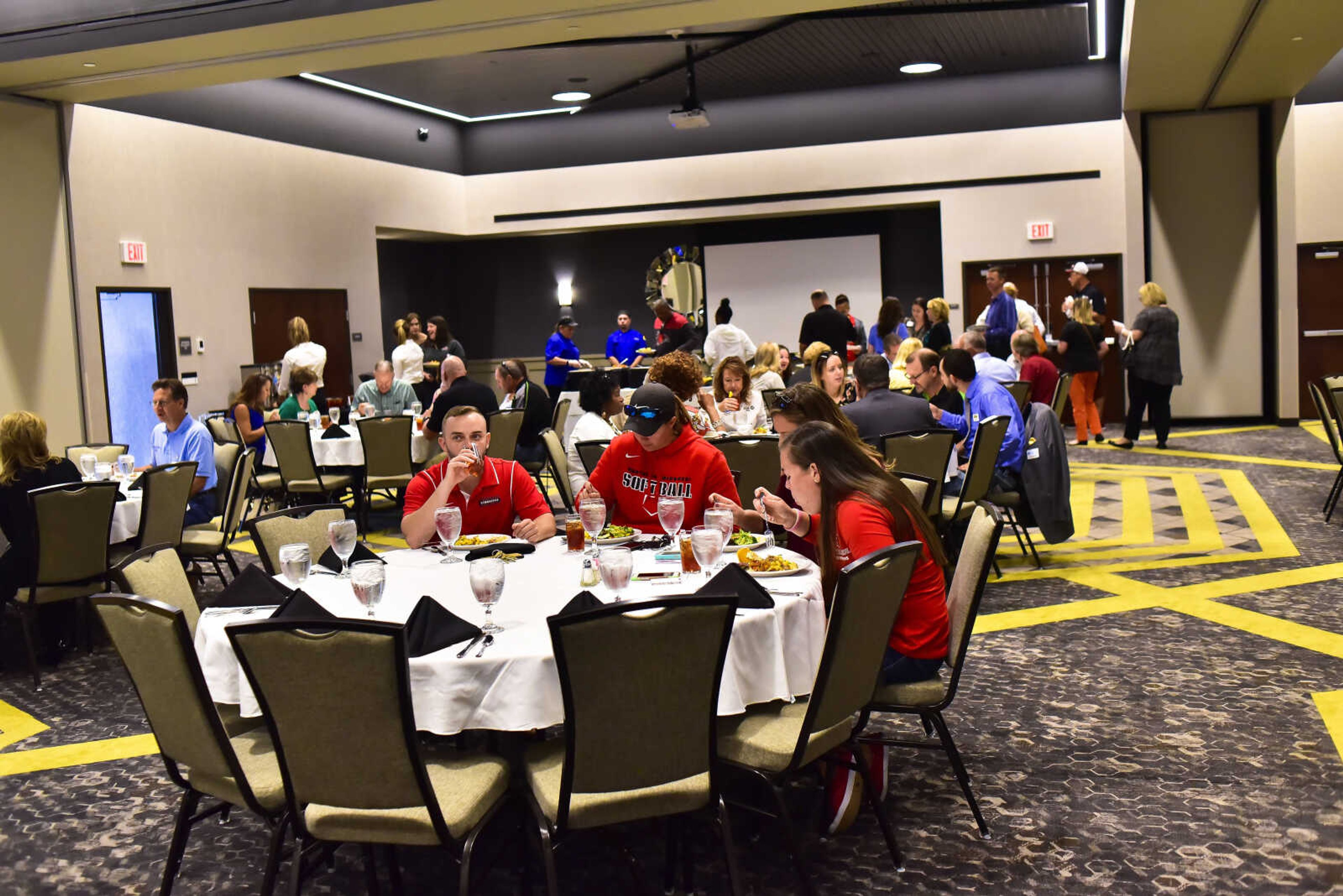 Community members eat lunch in a conference room for a ribbon cutting at the Drury Plaza Hotel Cape Girardeau Conference Center Thursday, Sept. 7, 2017 in Cape Girardeau.