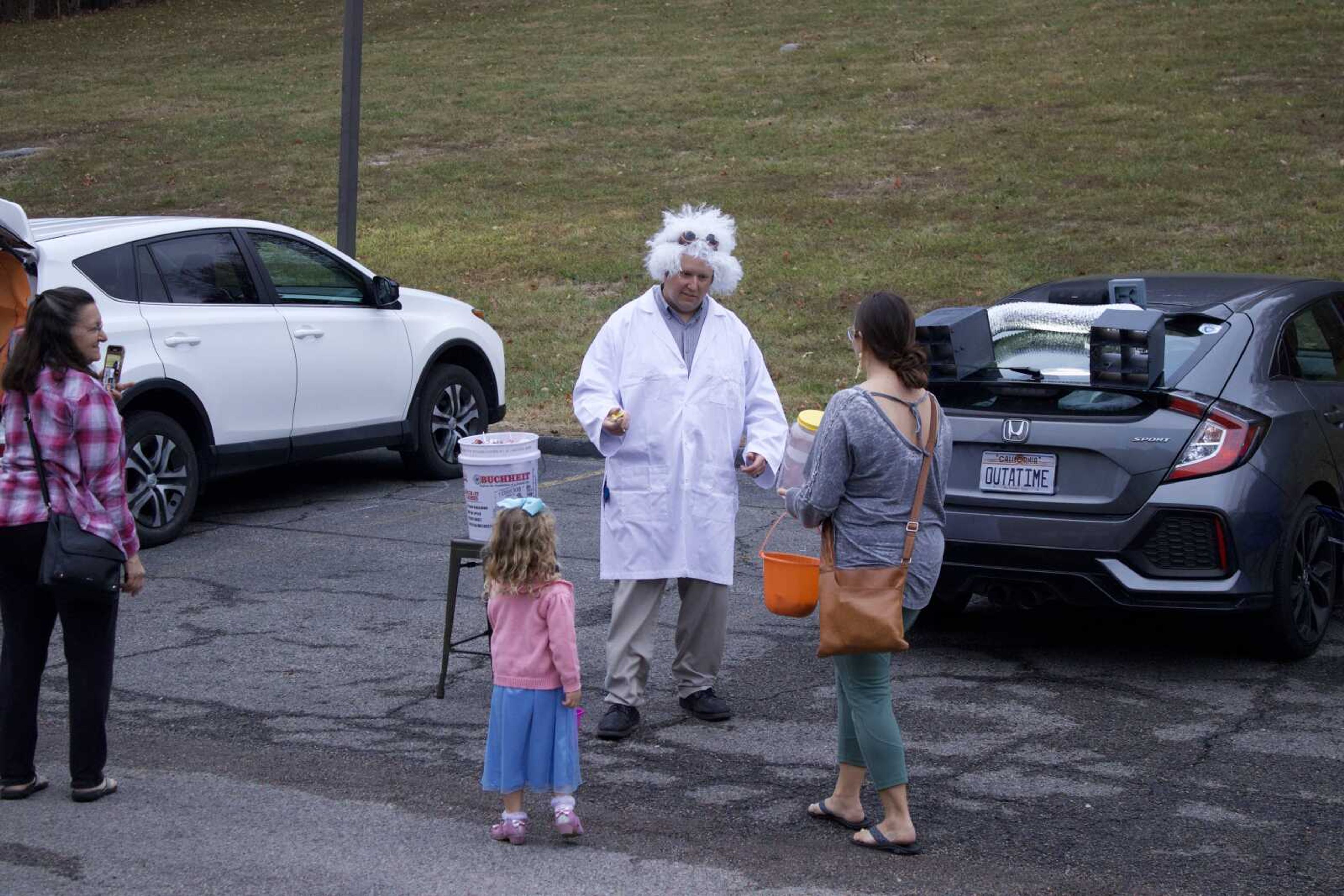 Ben
 Rhodes dressed as Dr. Emmett Brown from the 'Back to the Future '
franchise on Monday, Oct. 31 at Lynwood Baptist Church. He customized the rear of his car to look like the DeLorean. (Photo by Jeffery Long)