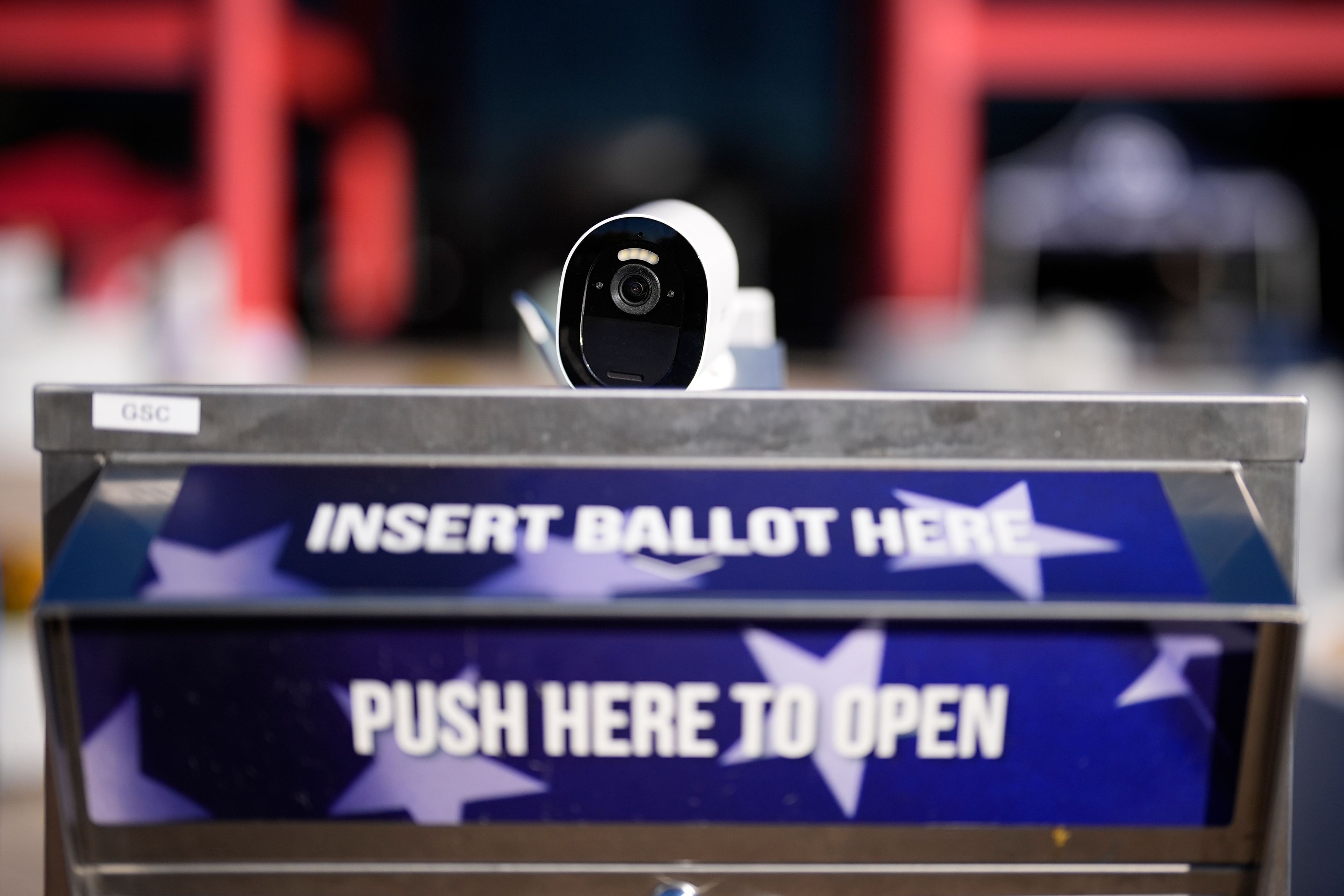 A security camera watches over a mail-in ballot drop box outside the Chester County Government Services Center ahead of the 2024 General Election in the United States, Friday, Oct. 25, 2024, in West Chester, Pa. (AP Photo/Matt Slocum)