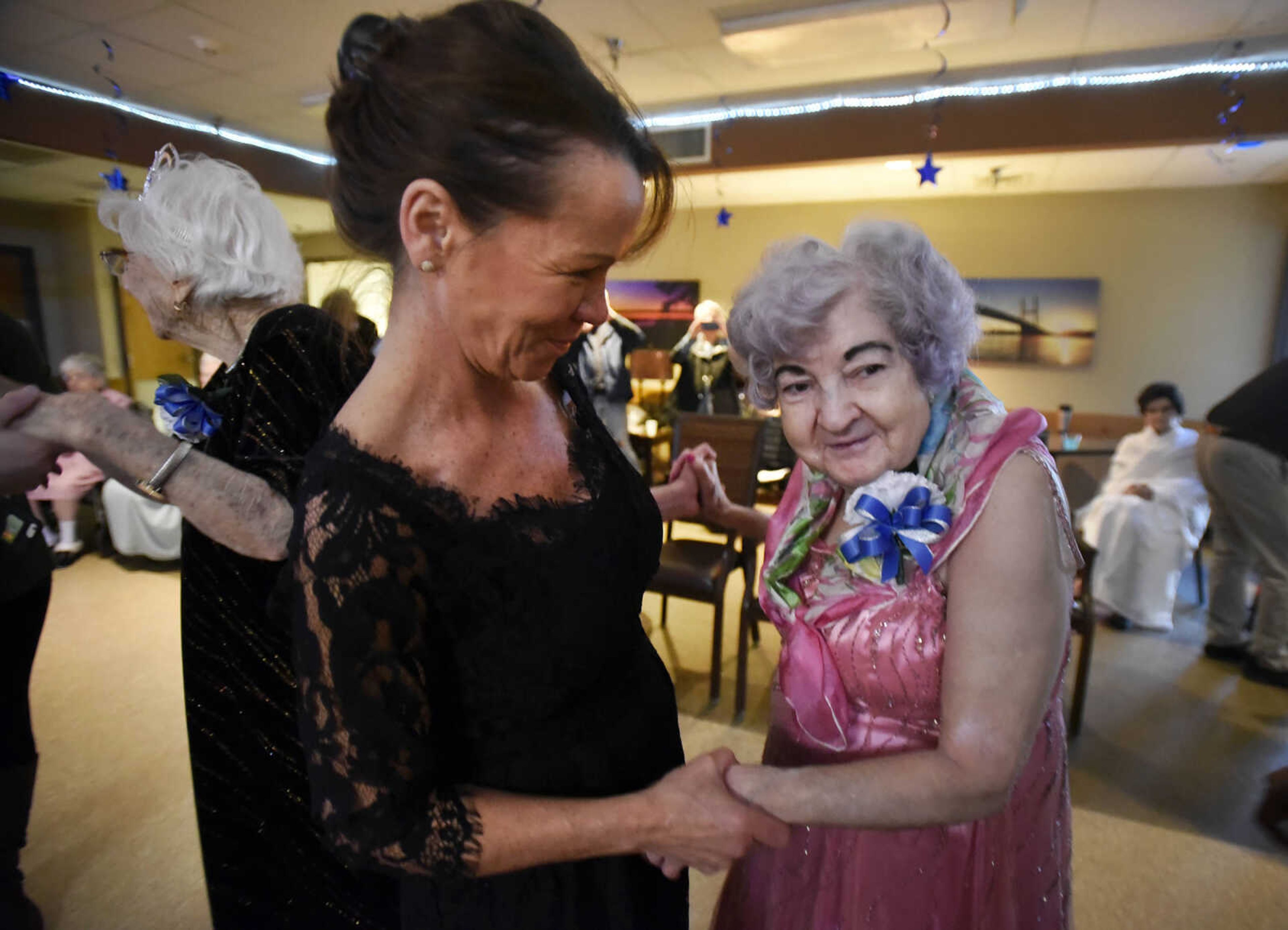 Charlotte Dow, right, takes a spin on the dance floor during the "Celebration of Life" winter ball on Tuesday, Jan. 9, 2017, at Ratliff Care Center in Cape Girardeau.