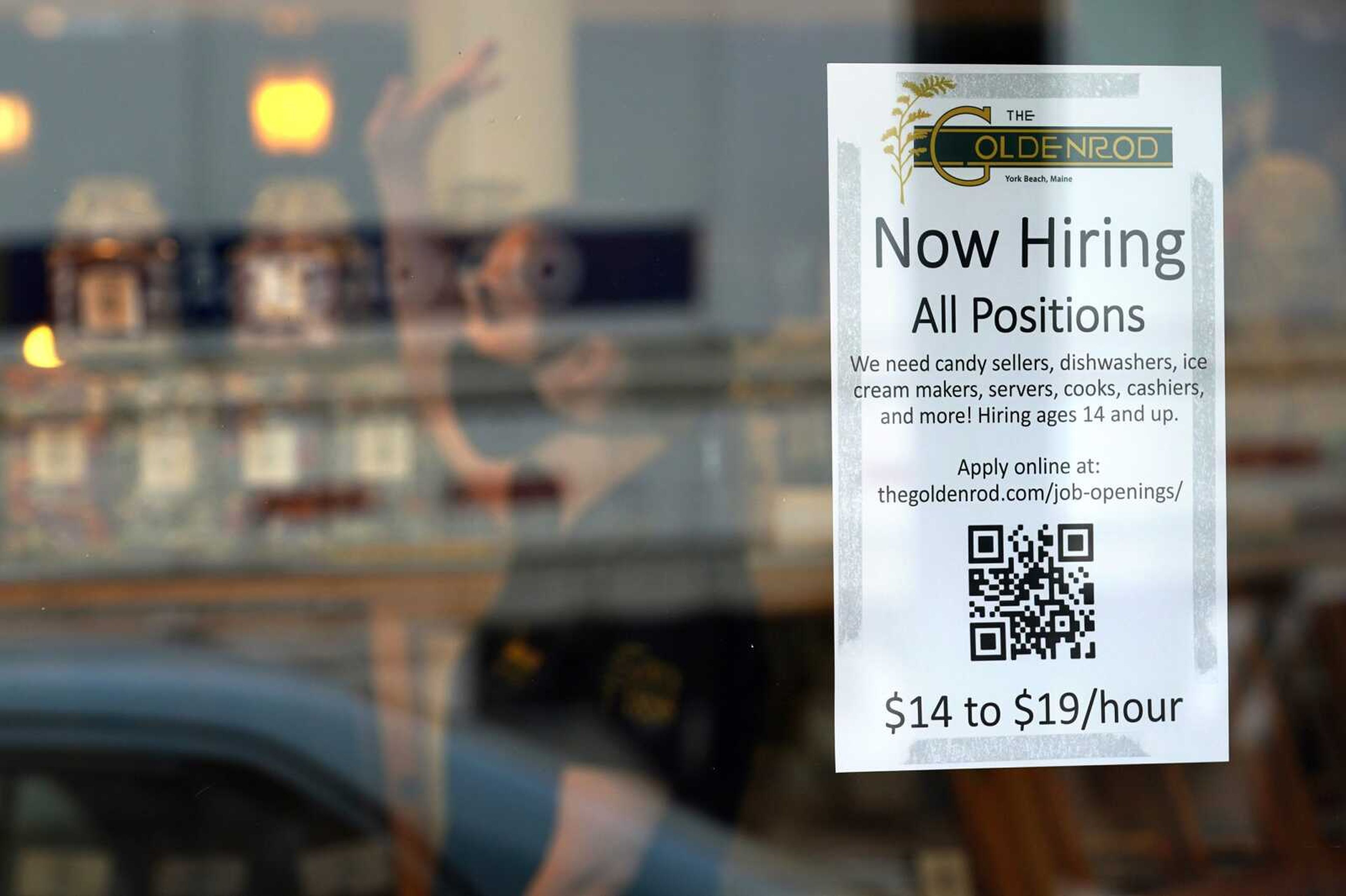 A sign advertises for help Wednesday, June 1, at a restaurant in York Beach, Maine. While the U.S. economy added jobs in October, the nation's unemployment rate rose to 3.7%.