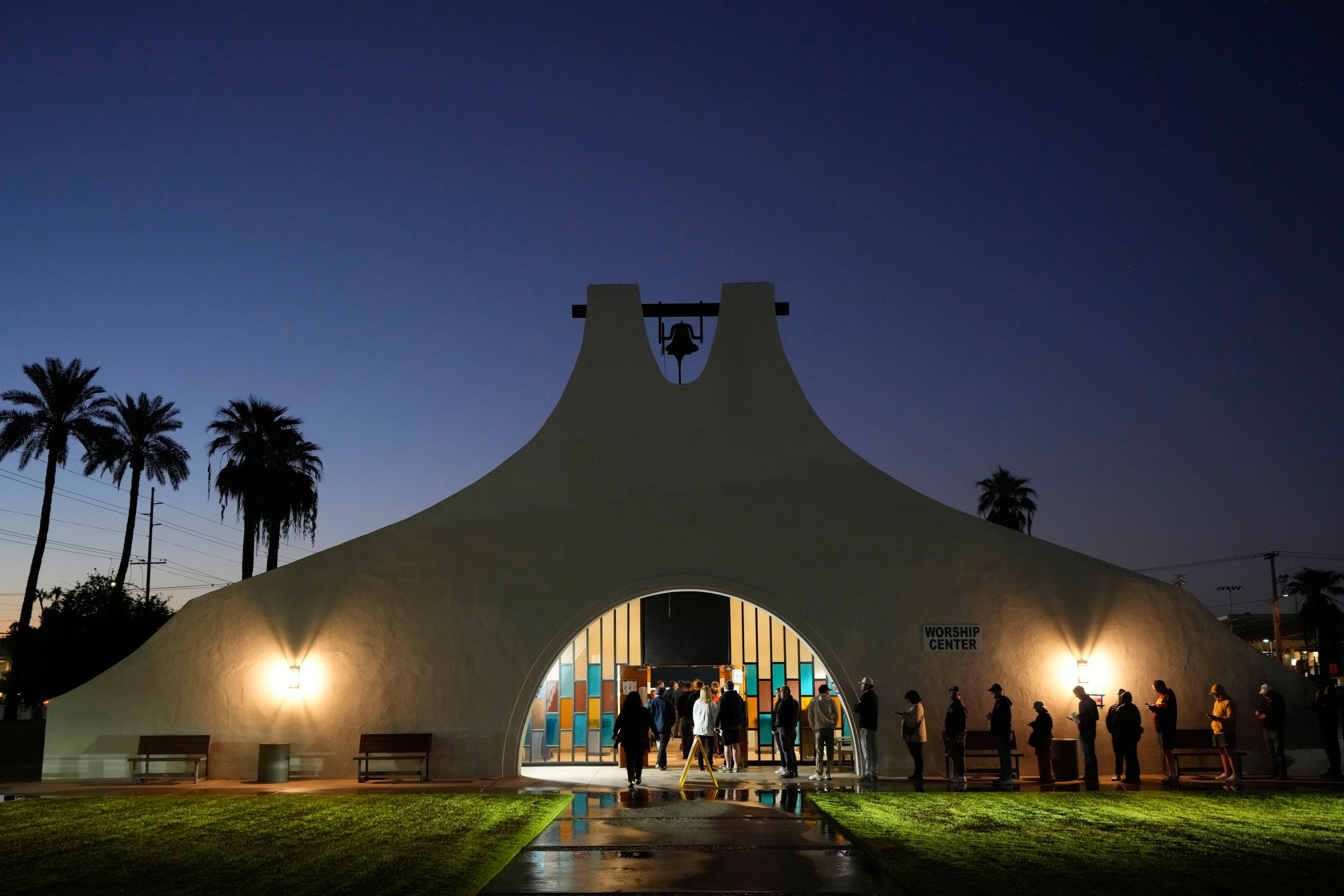 Voters stand in line outside a polling place at Madison Church, Tuesday, Nov. 5, 2024, in Phoenix, Ariz. (AP Photo/Matt York)