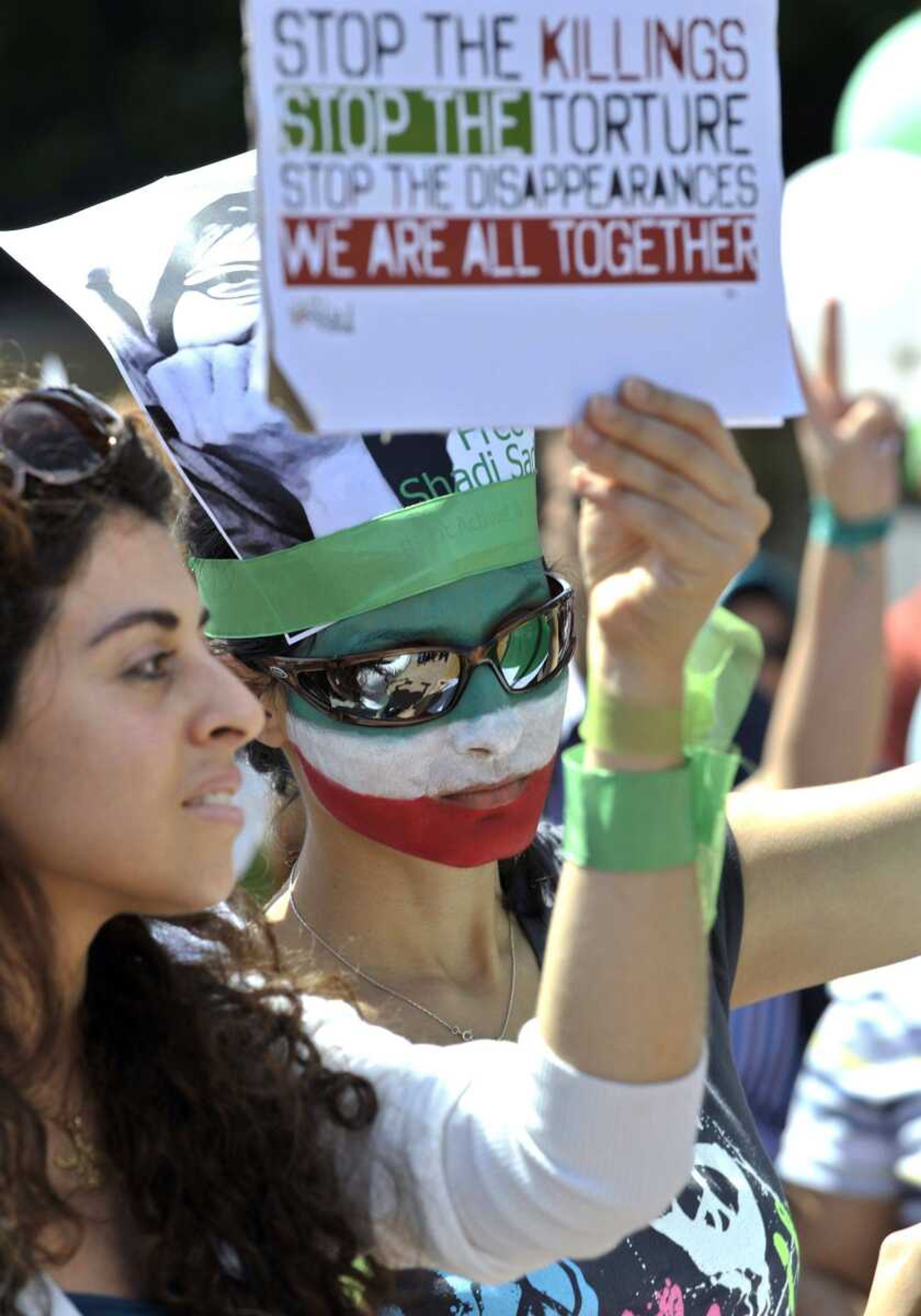 Iranians living in Switzerland demonstrate in front of the U.N. European headquarters Saturday in Geneva, Switzerland. The protest is part of the global day of action. (Martial Trezzini ~ Keystone)