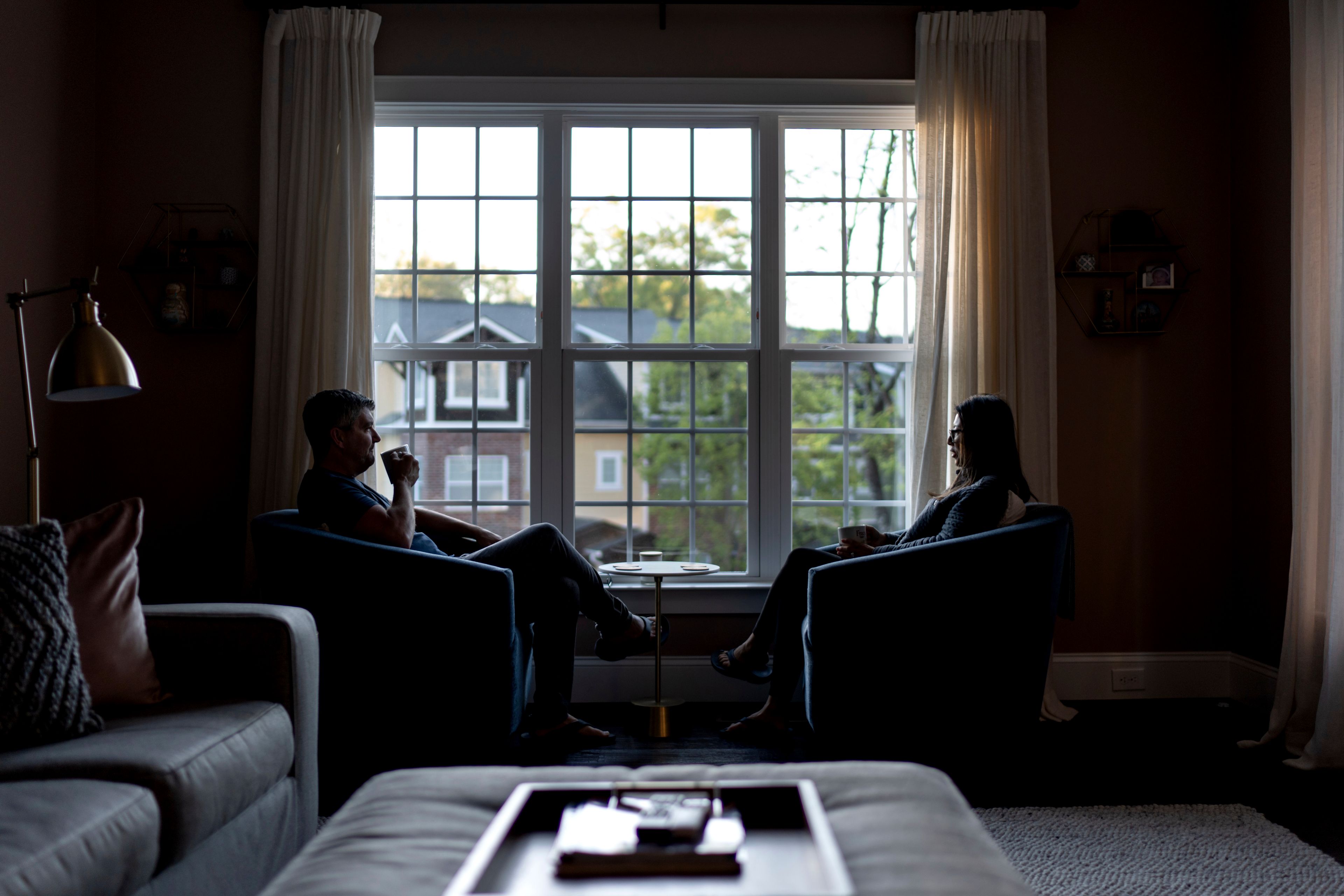 Dee Iraca, right, who was adopted as a baby out of South Korea to a family in the United States, sits with her husband, Sean, Saturday, April 6, 2024, at their home in Davidson, N.C. (AP Photo/David Goldman)