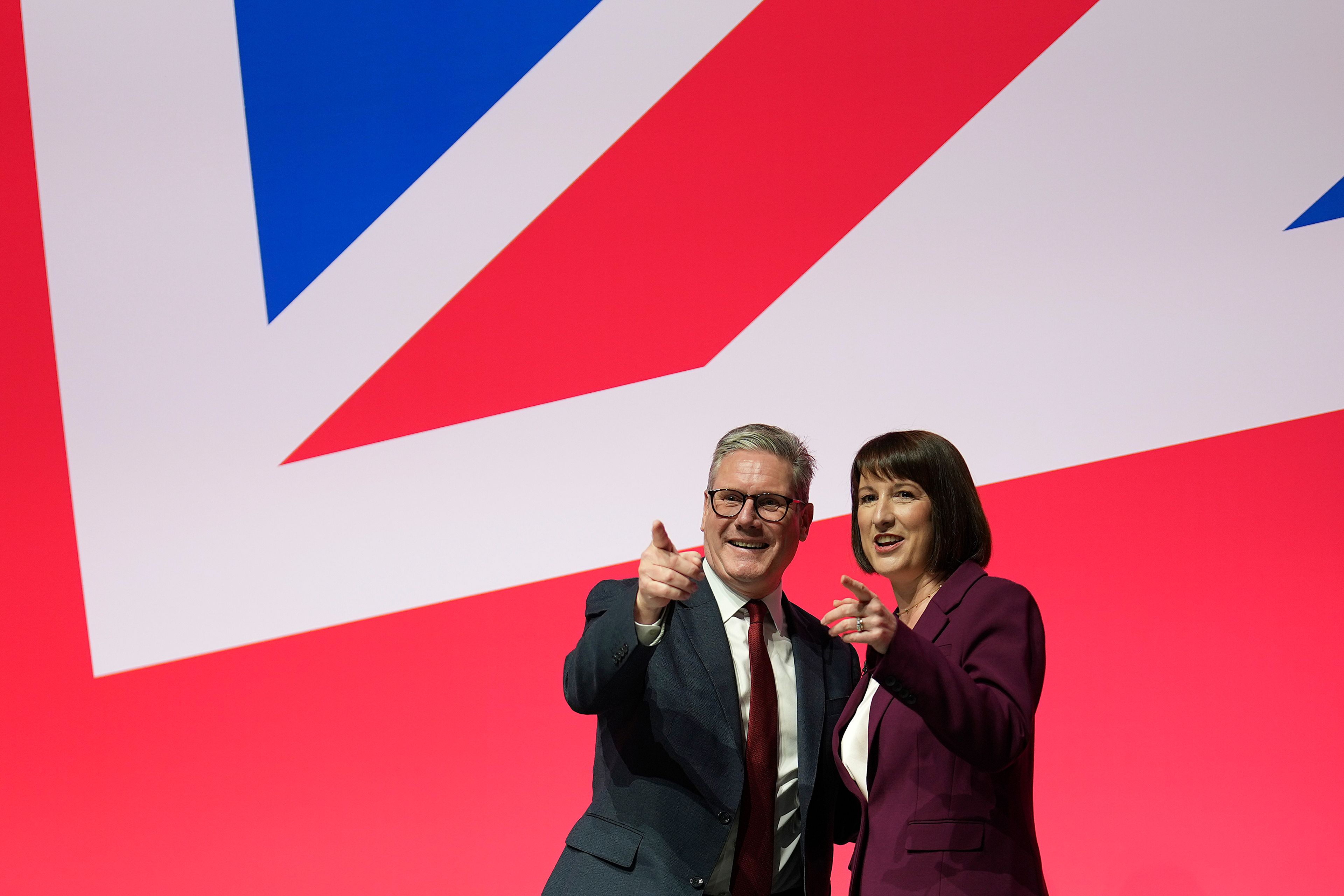 FILE - Britain's Prime Minister Keir Starmer and Britain's Chancellor of the Exchequer Rachel Reeves gesture after her speech at the Labour Party Conference in Liverpool, England, Monday, Sept. 23, 2024.(AP Photo/Jon Super, File)