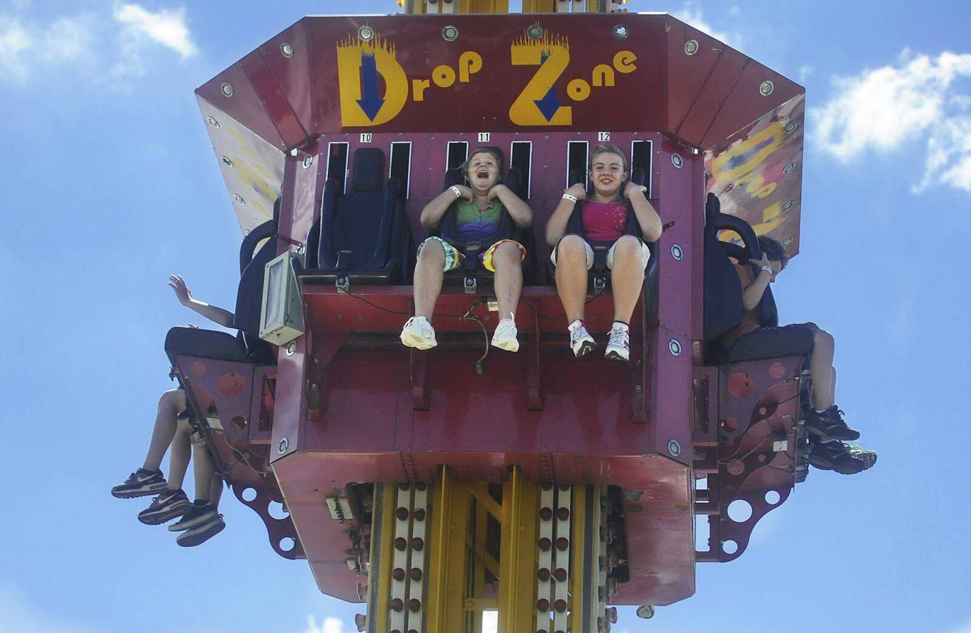 People fall on the Drop Zone ride at the SEMO District Fair Saturday, September 8, at Arena Park in Cape Girardeau. (ADAM VOGLER)