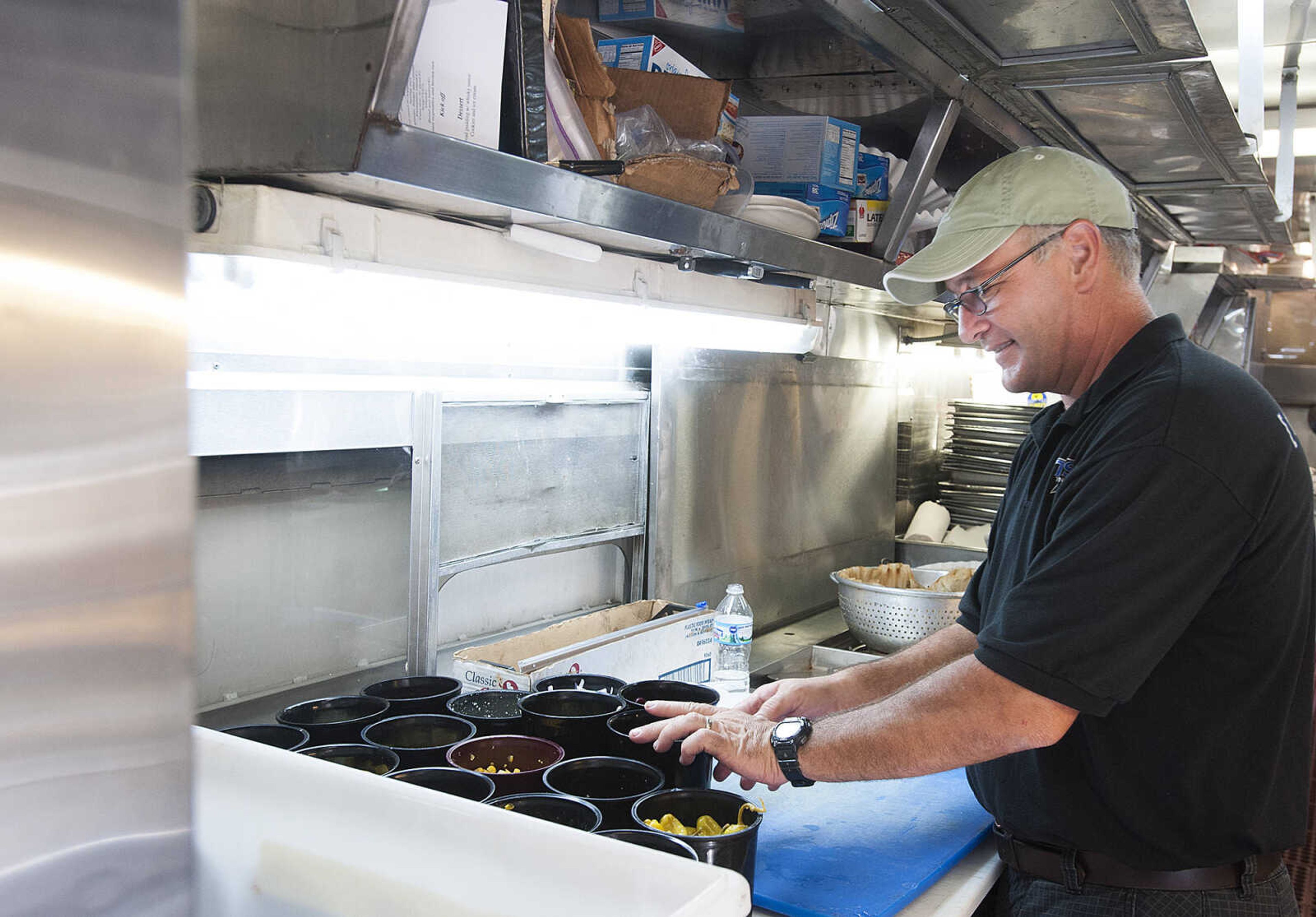 ADAM VOGLER ~ avogler@semissourian.com
For Stars Catering co-owner Lloyd Thomas at work preparing dinner for the cast and crew of the 20th Century Fox feature film "Gone Girl," Thursday, Oct. 3. at work  The Carlsbad N. M., based caterer is serving meals to up to 120 people each day.