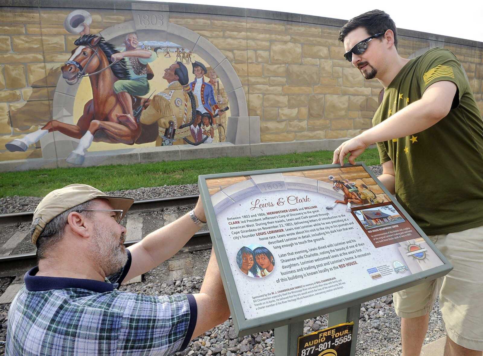 New interpretive plaques at the floodwall murals