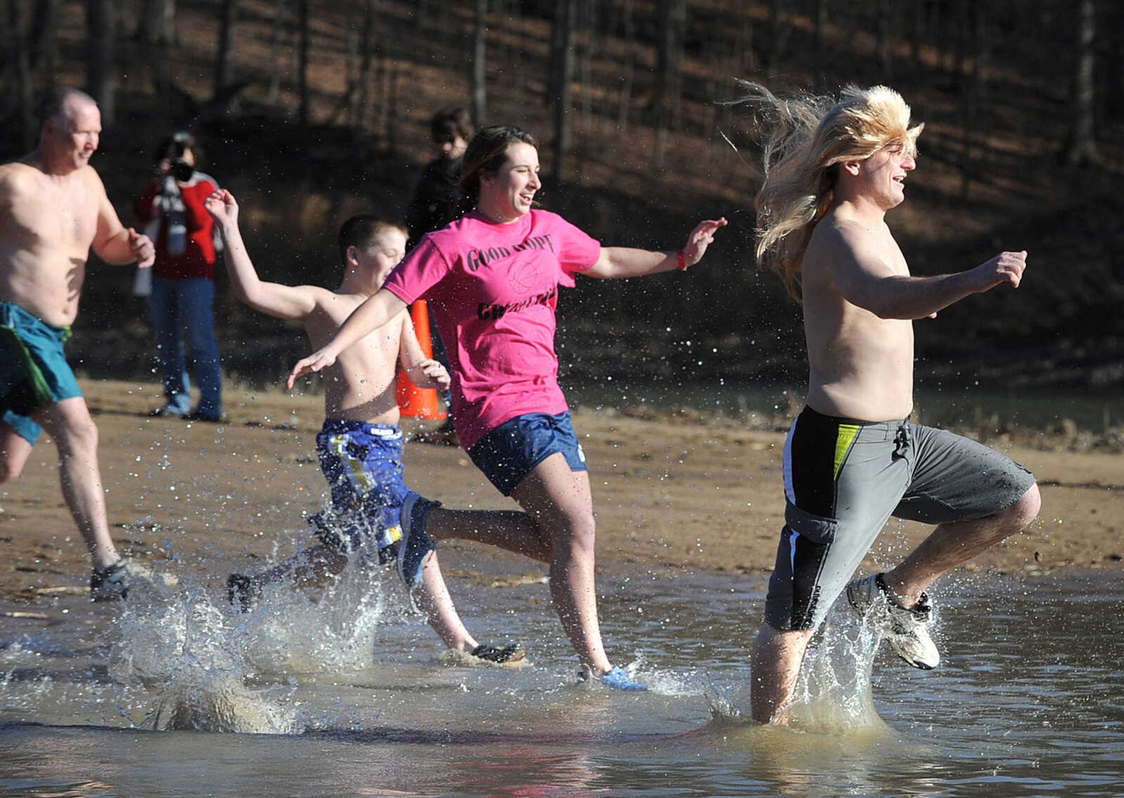 LAURA SIMON ~ lsimon@semissourian.com
People plunge into the cold waters of Lake Boutin Saturday afternoon, Feb. 2, 2013 during the Polar Plunge at Trail of Tears State Park. Thirty-six teams totaling 291 people took the annual plunge that benefits Special Olympics Missouri.