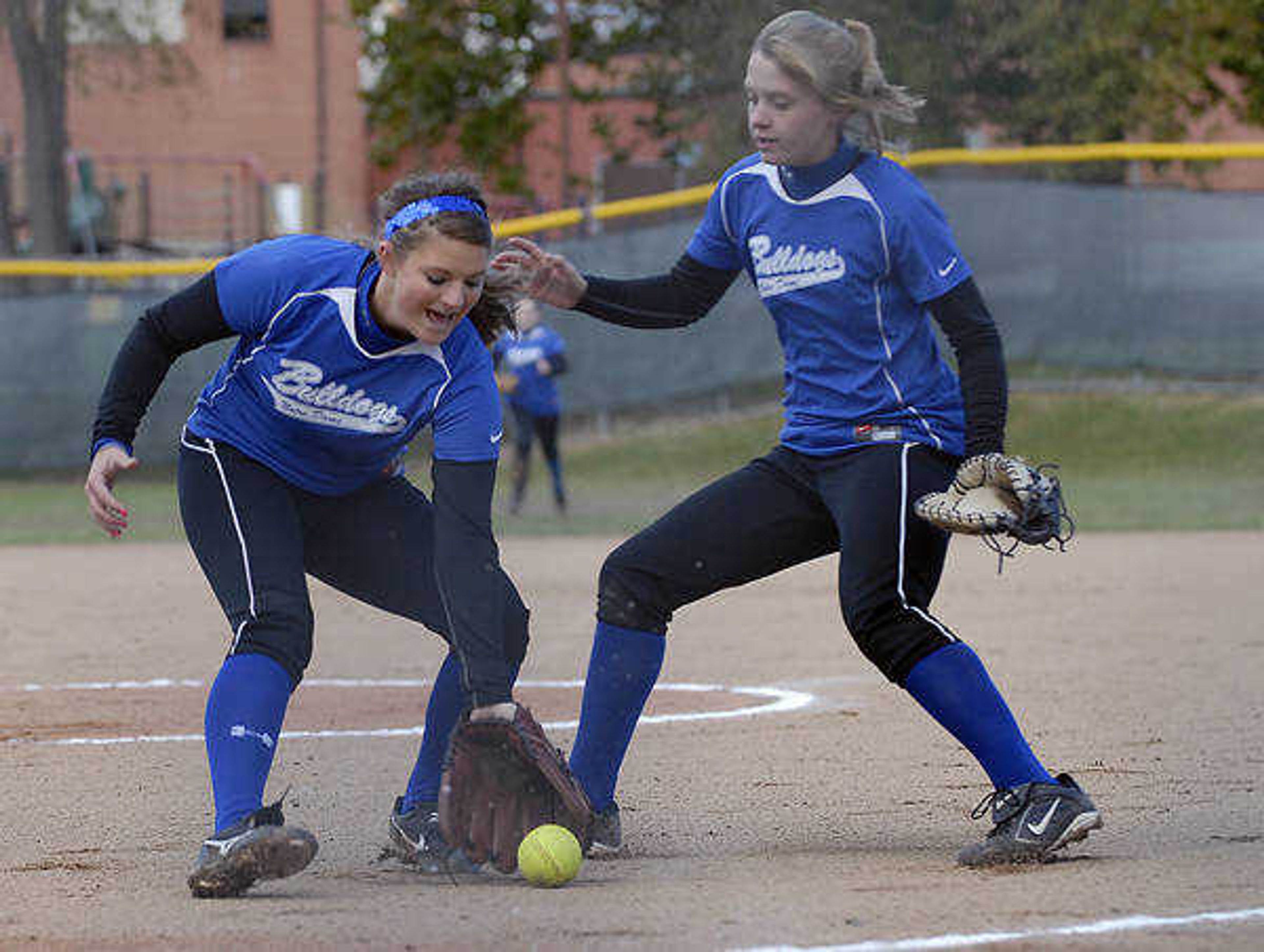 KIT DOYLE ~ kdoyle@semissourian.com
Pitcher Lauren Reinagel calls off first baseman Savanna Ayers to field a bunt Saturday afternoon, October 17, 2009, in Ballwin.