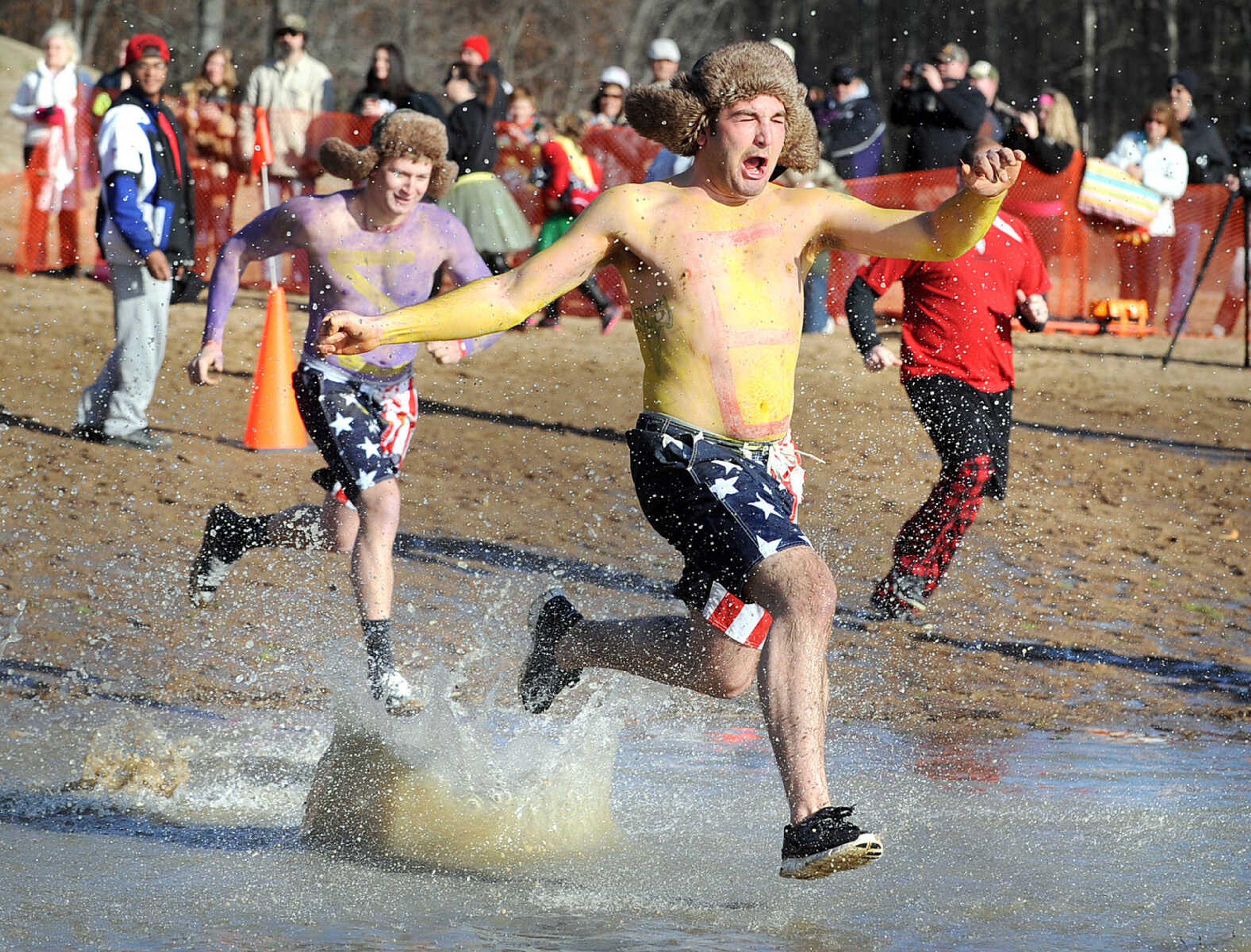 LAURA SIMON ~ lsimon@semissourian.com
People plunge into the cold waters of Lake Boutin Saturday afternoon, Feb. 2, 2013 during the Polar Plunge at Trail of Tears State Park. The lake's water temperature Saturday was 28 degrees. Thirty-six teams totaling 291 people took the annual plunge that benefits Special Olympics. Each team has to raise a minimum of 75 dollars to participate.