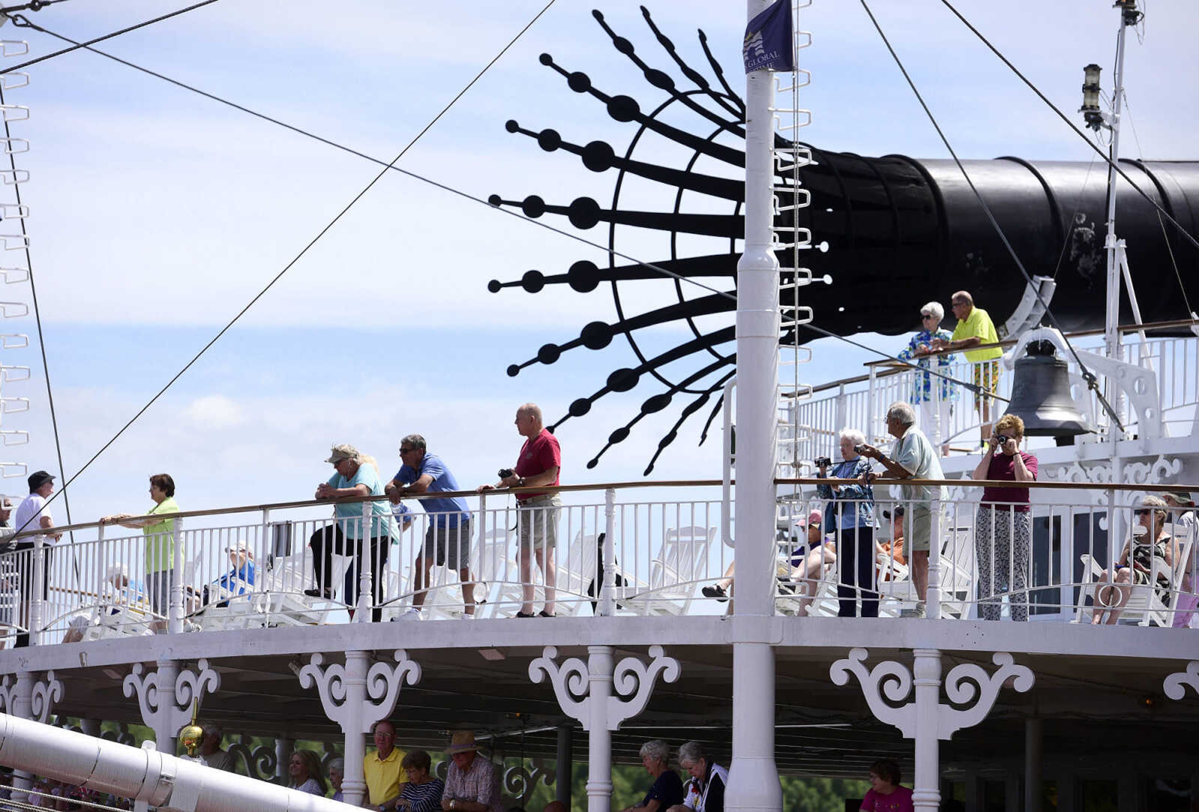 Passengers on the American Queen take in the from the deck as the riverboat prepares to depart Riverfront Park on Wednesday, Aug. 23, 2017, in downtown Cape Girardeau.