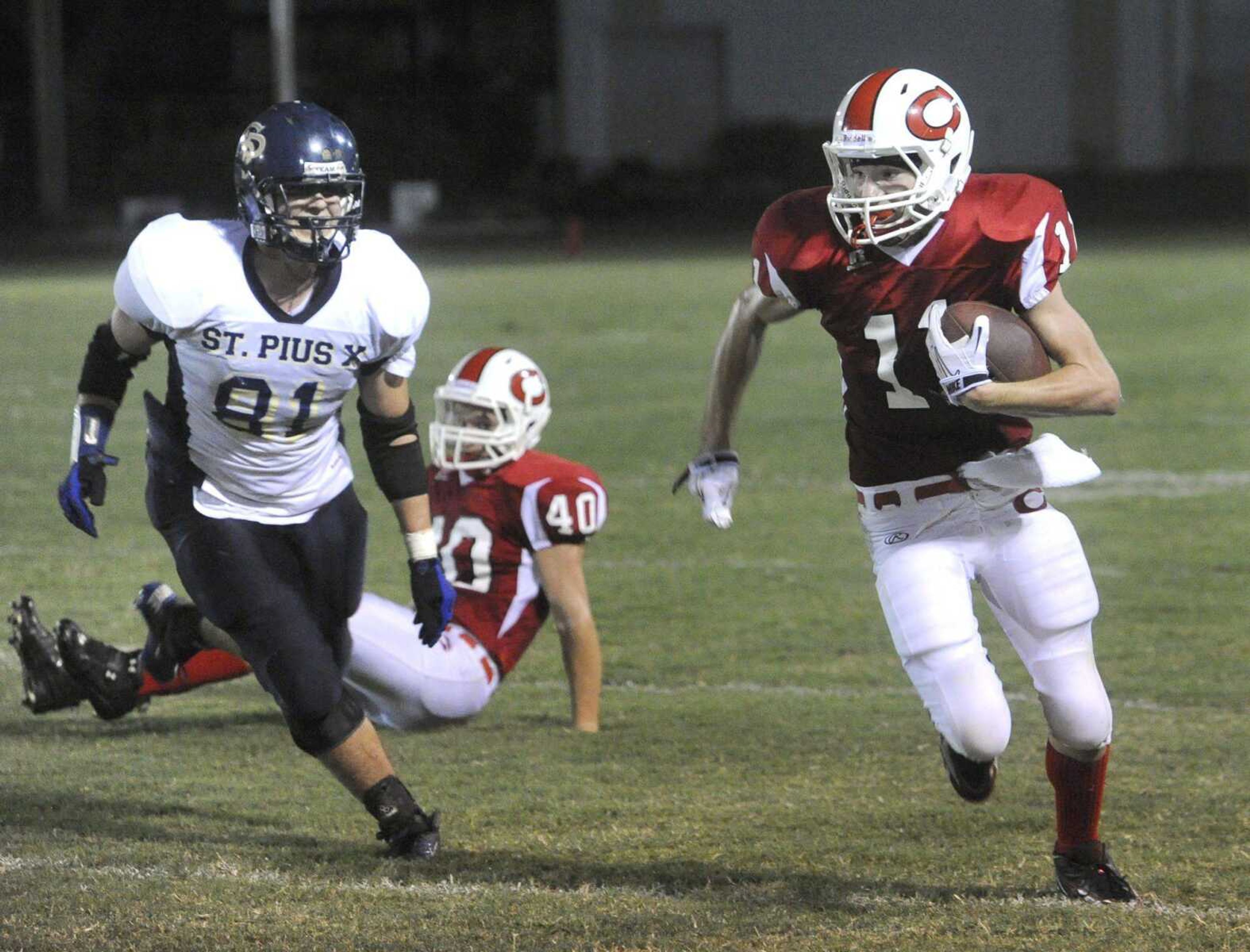 Chaffee's Mike Rutherford is pursued by St. Pius' Luke Rumping as Rutherford scurries for the end zone during the second quarter Friday at Chaffee High School.