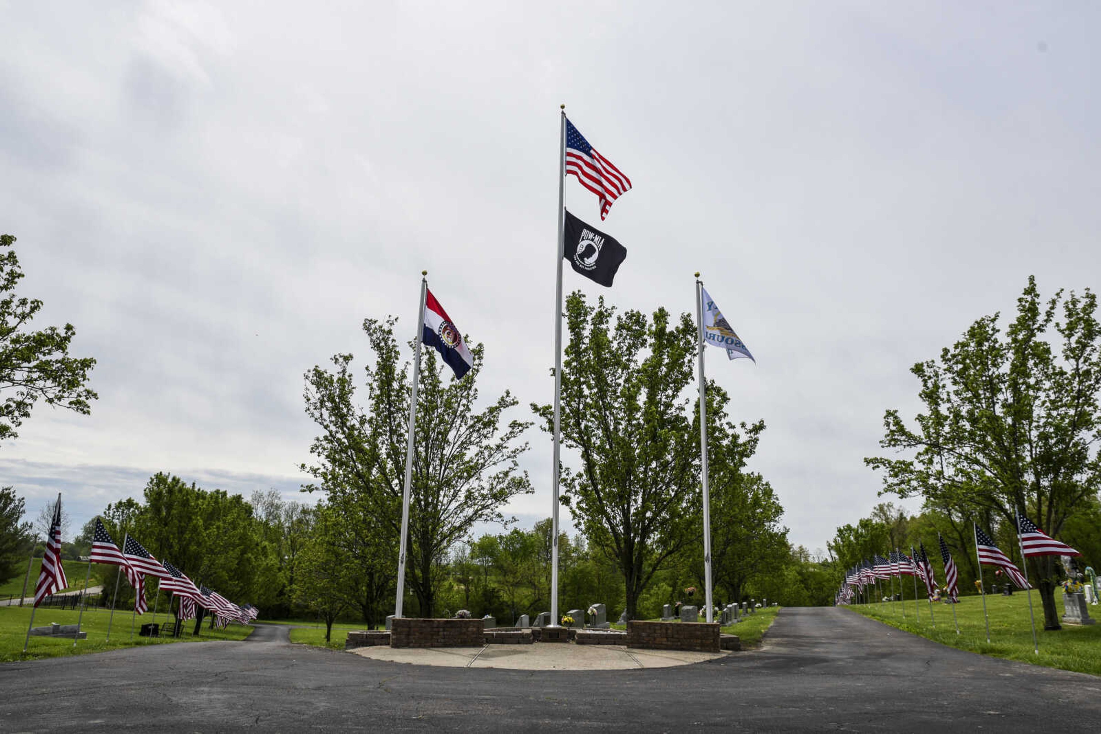 Flags fly in honor of veterans Saturday, May 5, 2018, at the Lightner Cemetery in Scott City.