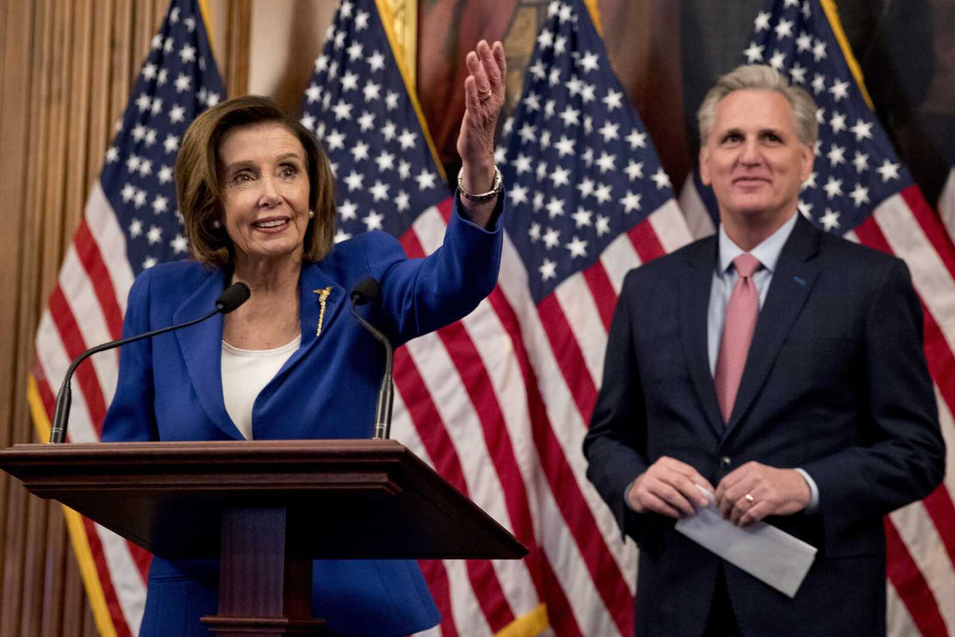 House Speaker Nancy Pelosi accompanied by House Minority Leader Kevin McCarthy speaks Friday before signing the Coronavirus Aid, Relief and Economic Security (CARES) Act after it passed in the House on Capitol Hill.