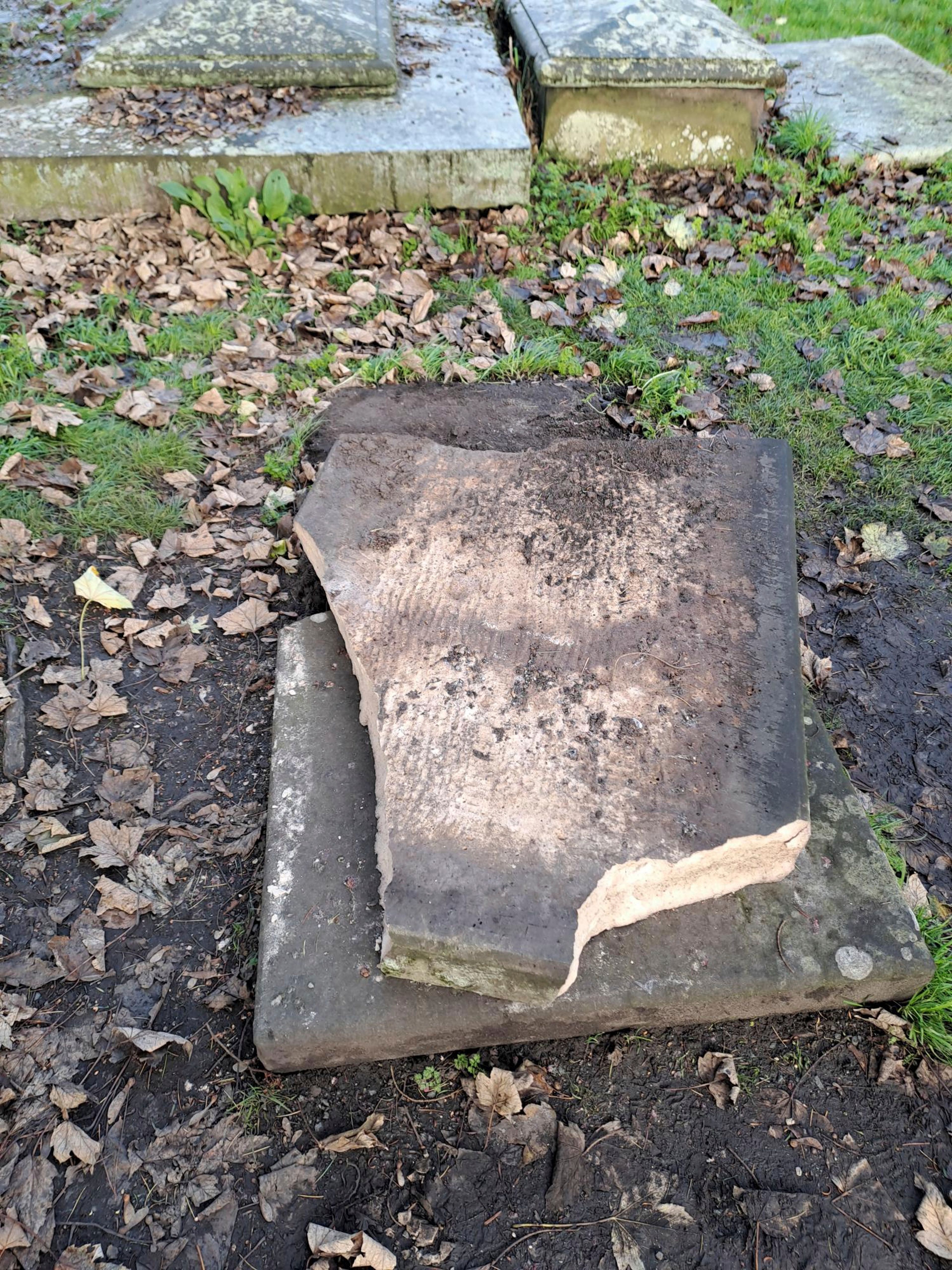 In this picture, provided by the West Mercia Police on Monday, Nov. 25, 2024, a smashed movie prop tombstone that was used for the "A Christmas Carol" movie is seen in Shrewsbury, England. (West Mercia Police via AP)