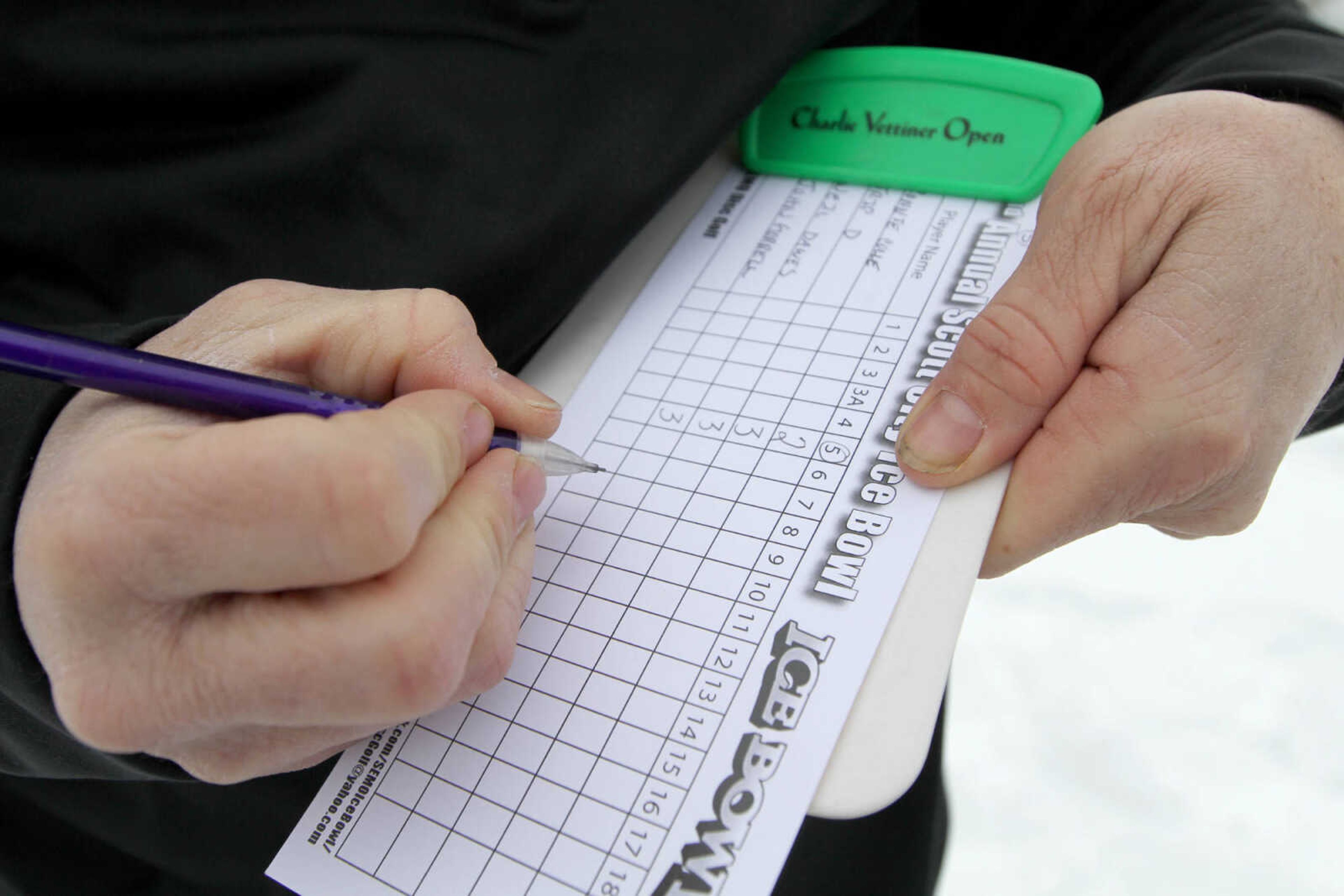 GLENN LANDBERG ~ glandberg@semissourian.com

Neil Dawes tallies up scores after the first hole during the 2nd annual Scott City Ice Bowl disc golf tournament Saturday, Feb. 28, 2015 at Scott City Park.