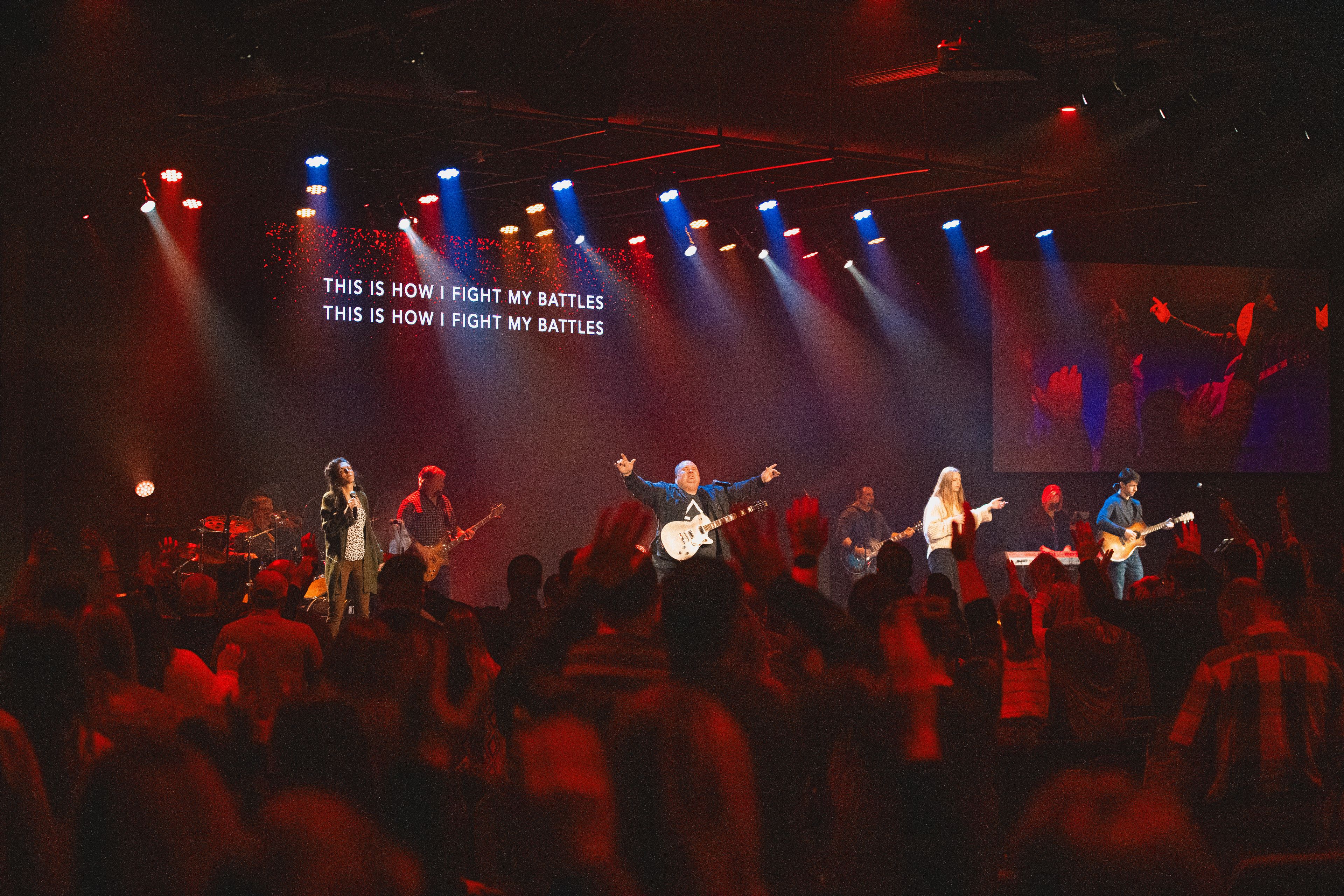 The Connection Point Church congregation sings in worship during a service.