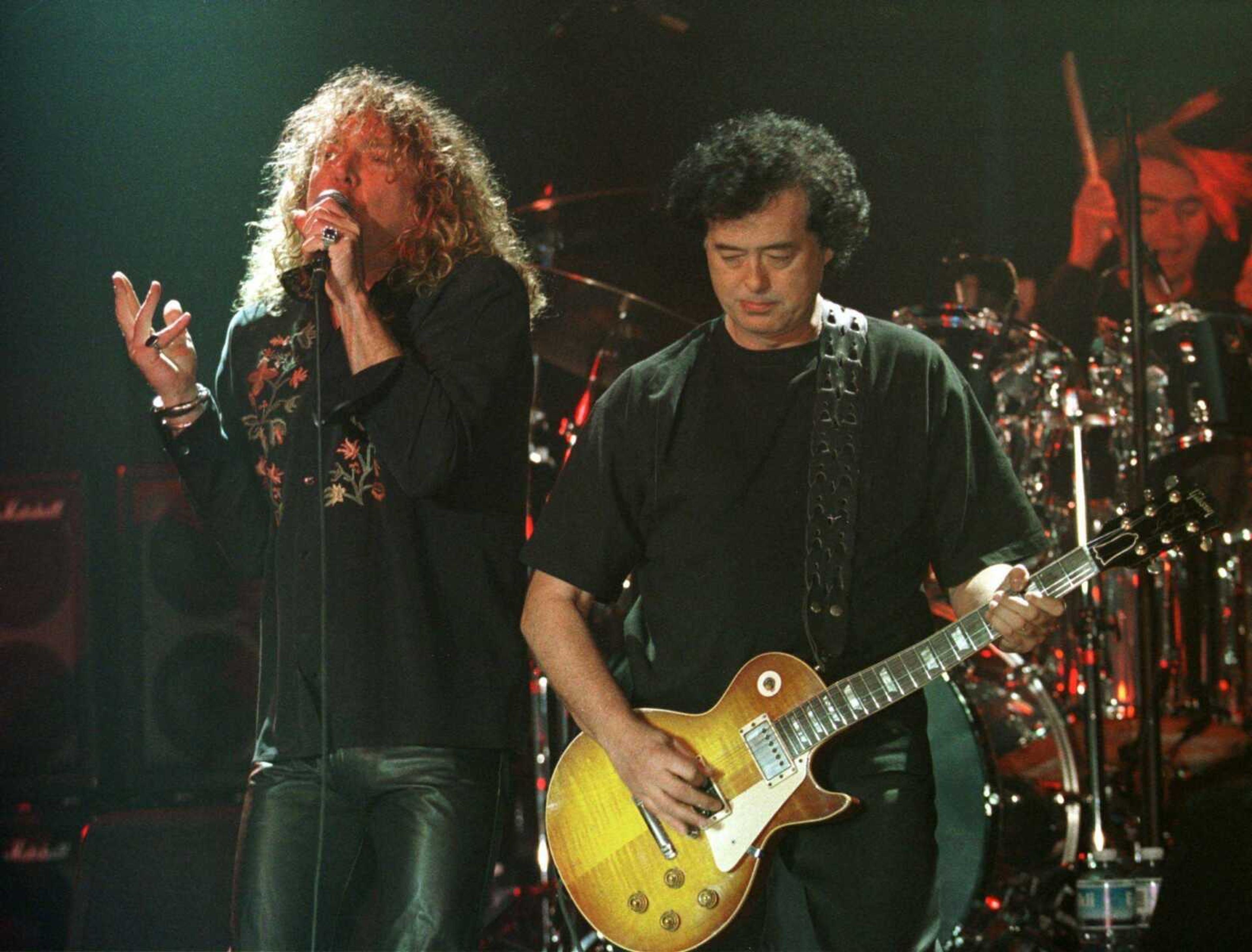 Led Zeppelin's Robert Plant, left,  performed with guitarist Jimmy Page during their concert in Istanbul in this March 5, 1998, file photo. The band's most recent reunion, Monday night in London, earned rave reviews and raised hopes for a tour. (Associated Press file)