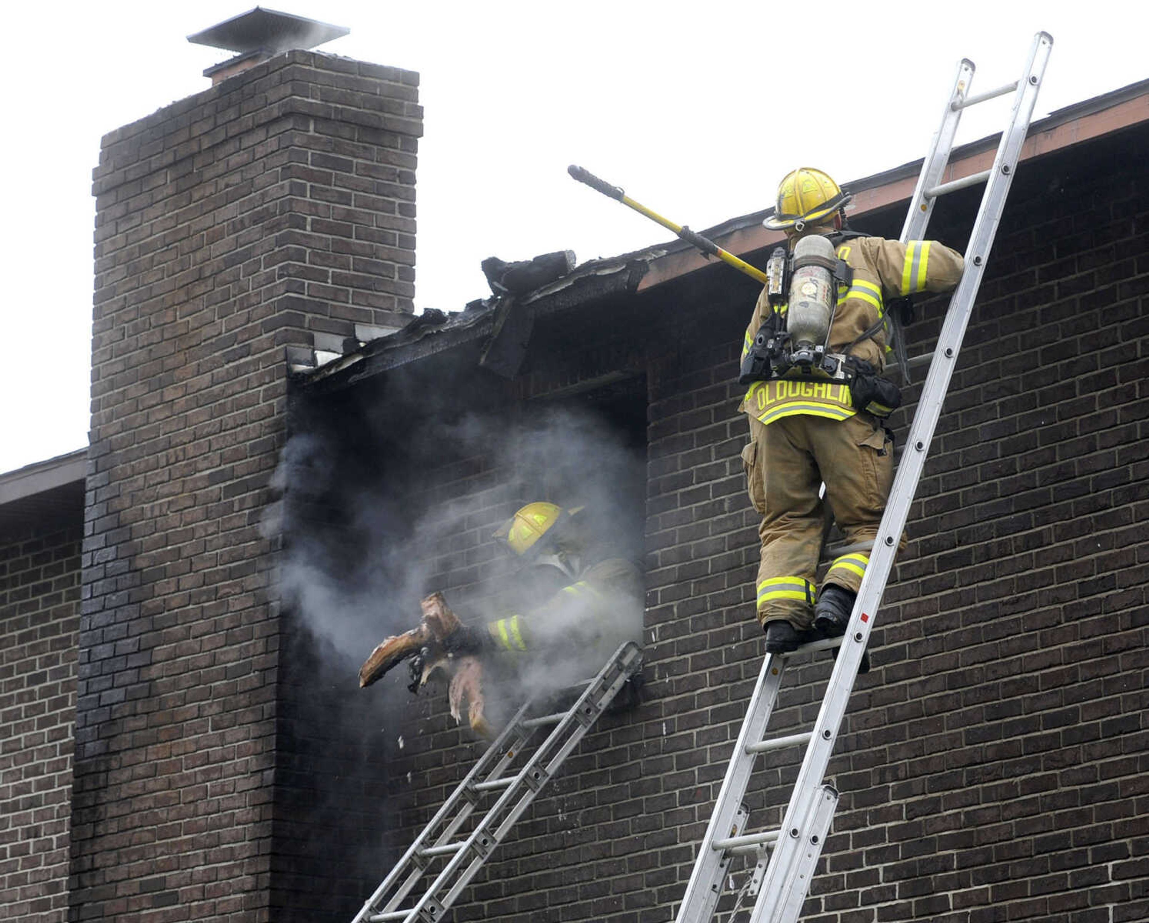 Cape Girardeau firefighters respond to a fire at 916 N. Fountain St. on Monday afternoon, Feb. 4, 2013. (Fred Lynch)