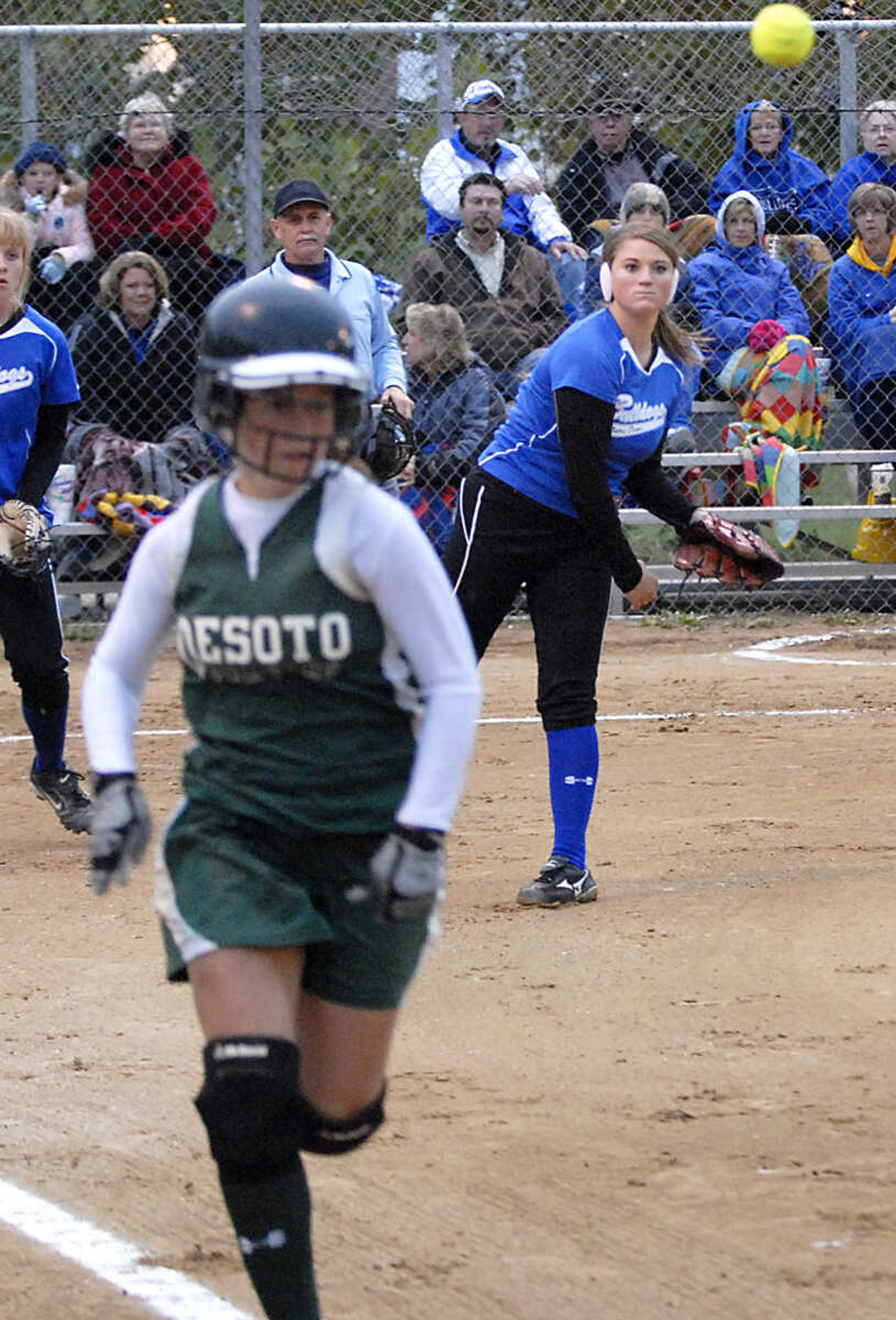 KIT DOYLE ~ kdoyle@semissourian.com
Notre Dame pitcher Lauren Reinagel, right, throws out a DeSoto runner on a bunt Thursday, October 15, 2009, in Poplar Bluff.